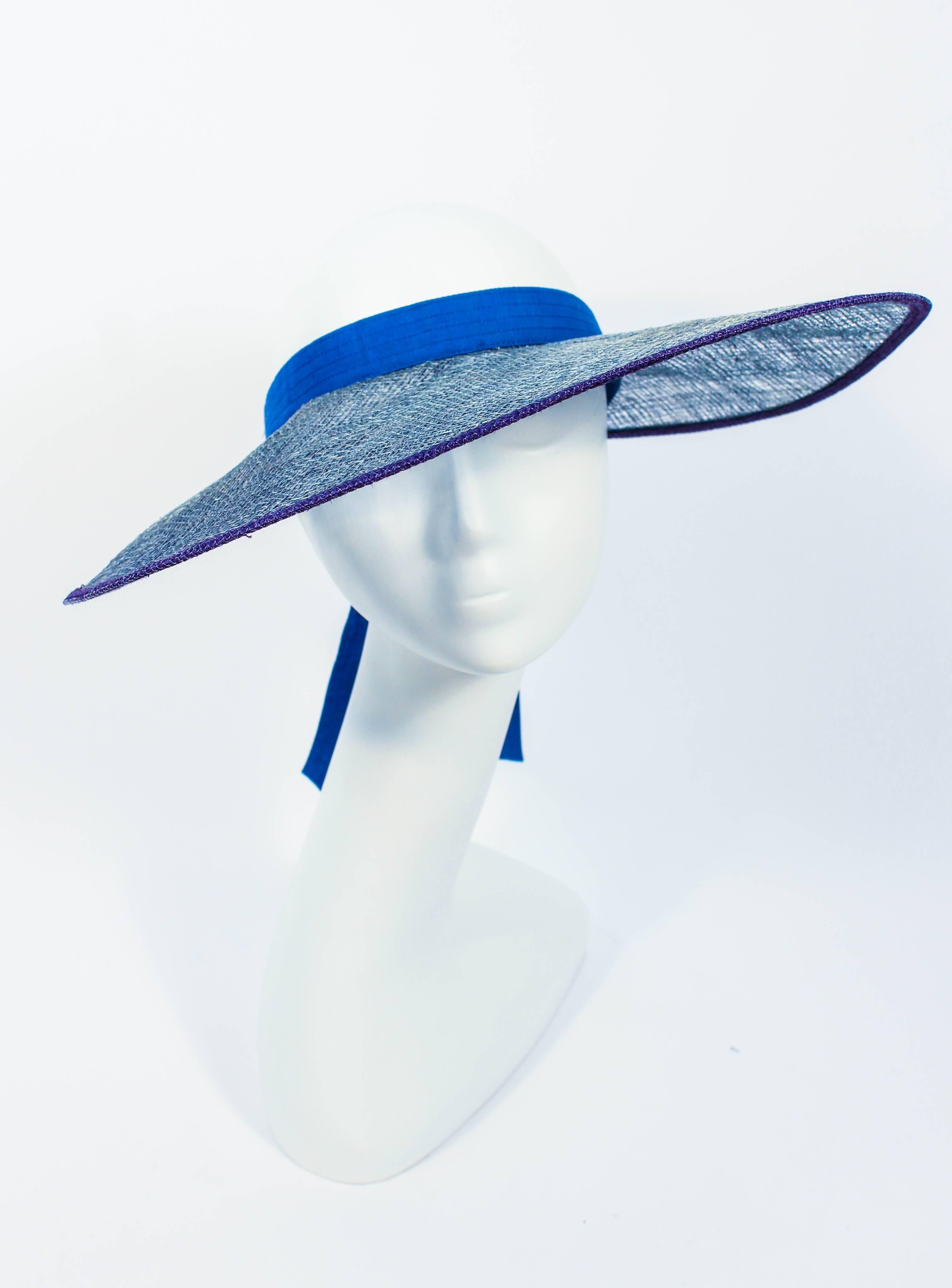 This Yves Saint Laurent hat is composed of blue mesh. Features a tie back. Made in France. In excellent vintage condition.

**Please cross-reference measurements for personal accuracy. Size in description box is an estimation. 

Measures