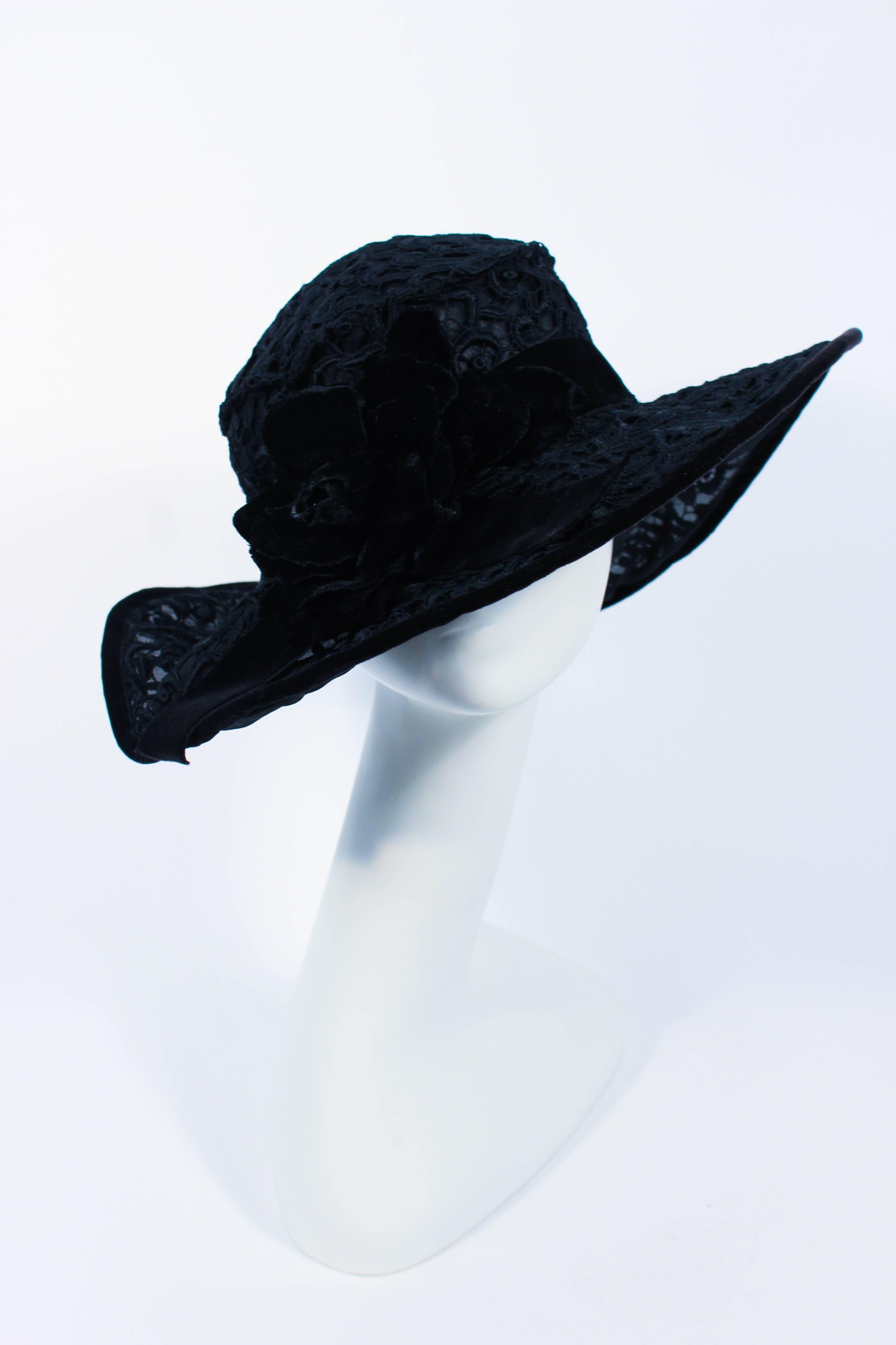 This hat is composed of black velvet and silk. Features a floral pattern. A beautiful and chic design. In excellent vintage condition.

**Please cross-reference measurements for personal accuracy. Size in description box is an estimation. 

Measures