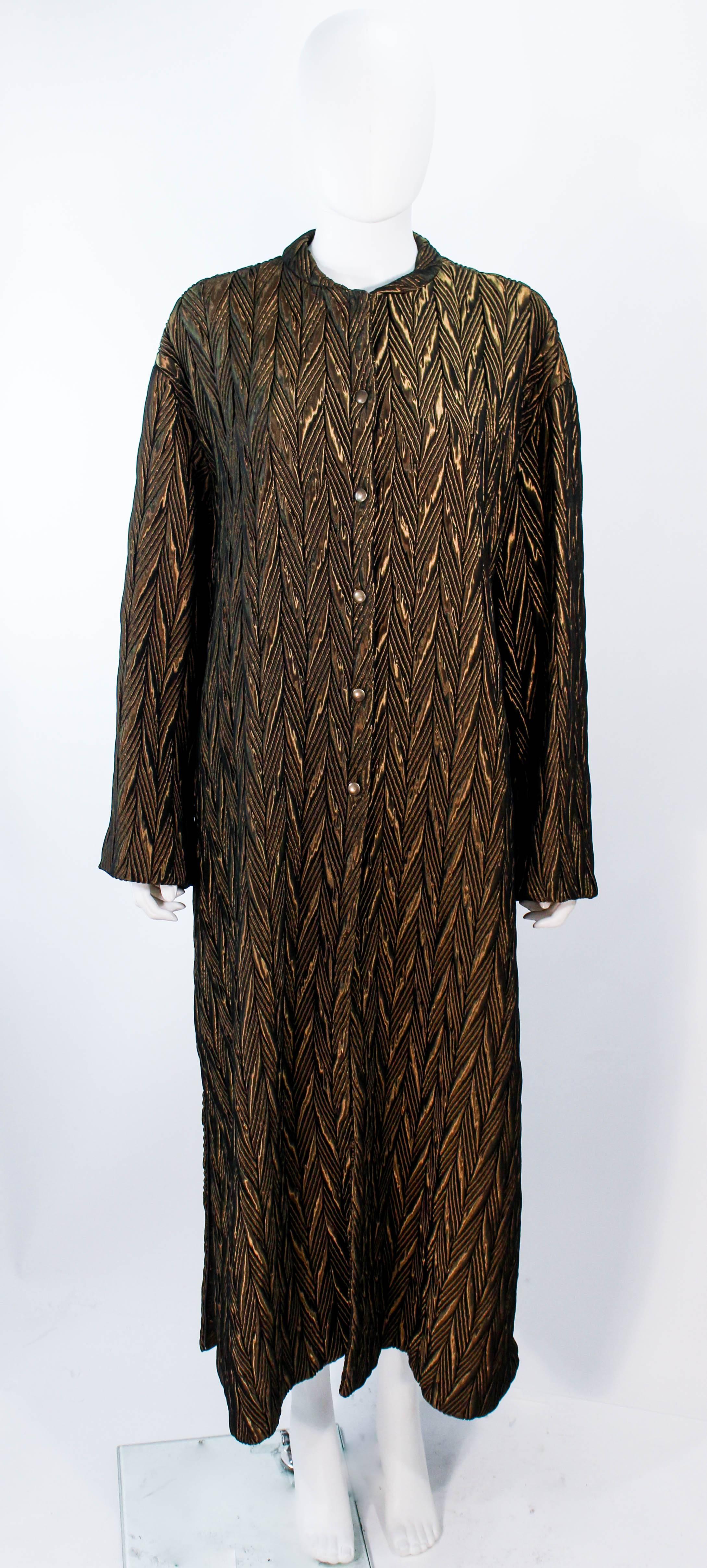 Armani floor-length coat 
Bronze olive nylon blend 
Quilted in a chevron pattern 
Side zippers 
Bronze snap closures 
Silk lined 
Made in Italy 