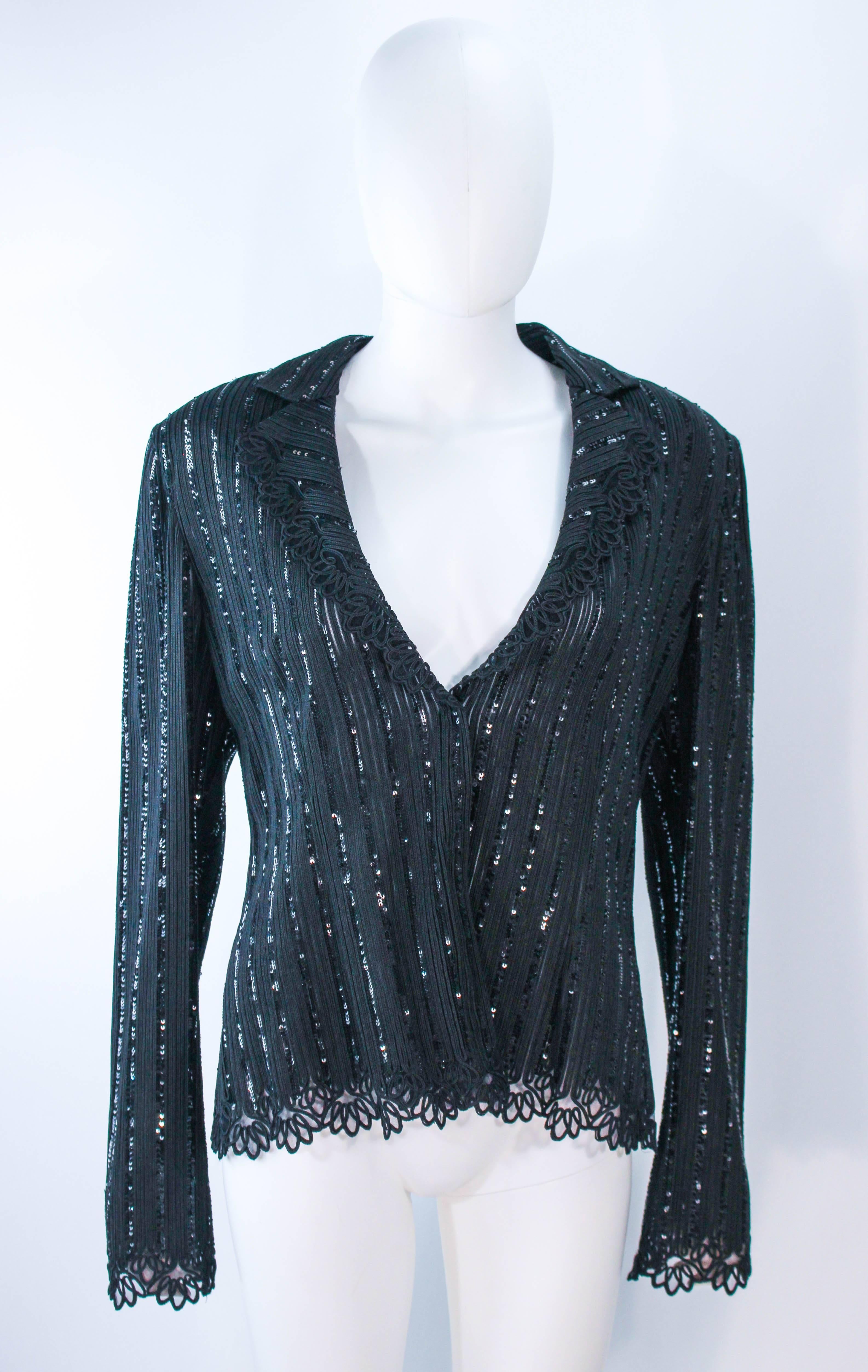 This Giorgio Armani sweater is composed of a black knit with lace trim and sequin applique. There are center front closures. In excellent condition. 

**Please cross-reference measurements for personal accuracy. Size in description box is an