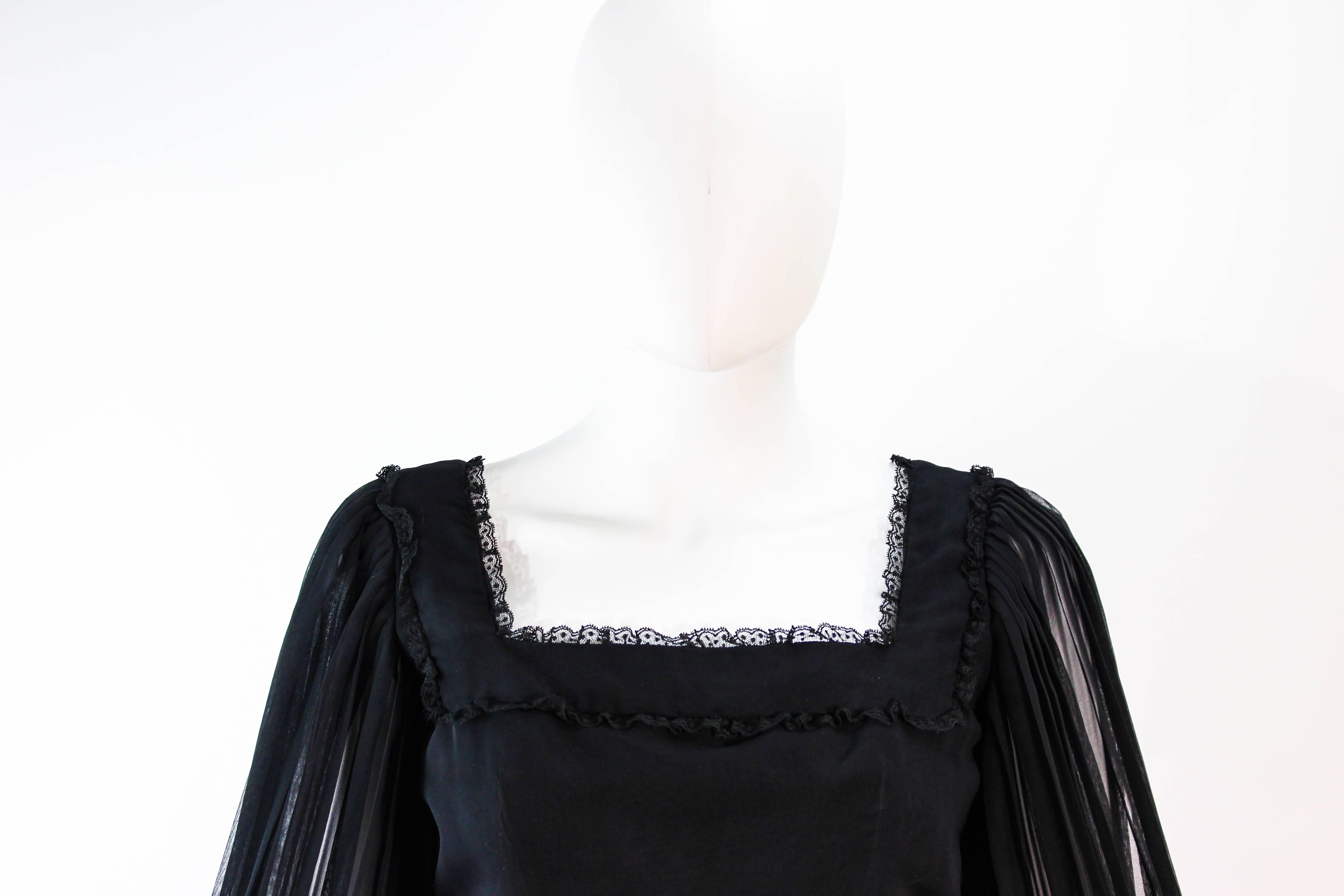 black pleated dress with sleeves