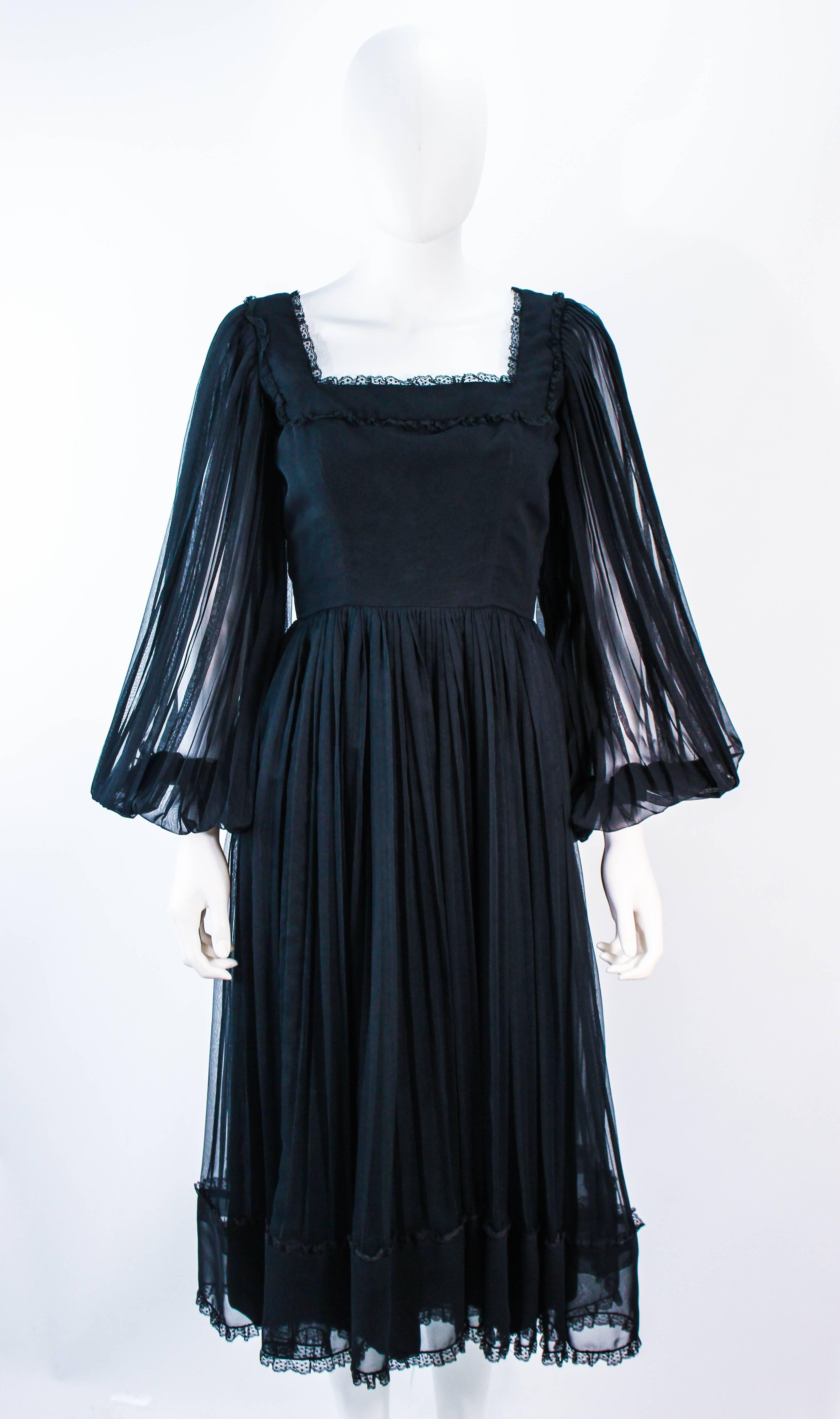 black dress with sheer sleeves