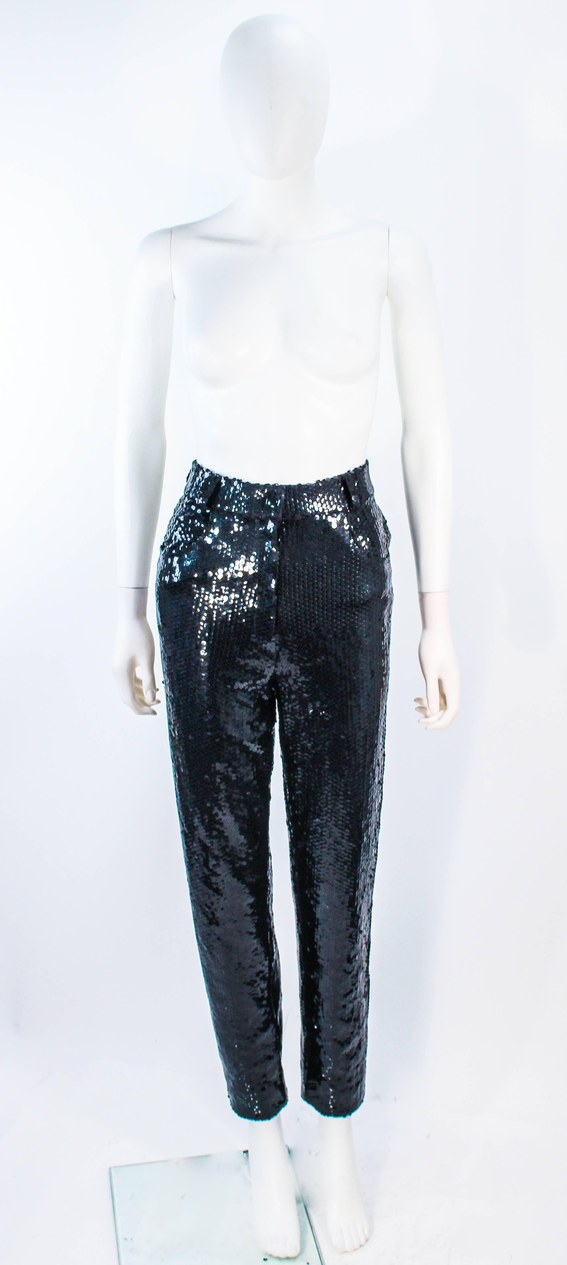  These Suite 101 pants are composed of black sequins on a stretch material. Features a high waist style. In excellent vintage condition. 

**Please cross-reference measurements for personal accuracy. Size in description box is an estimation.
