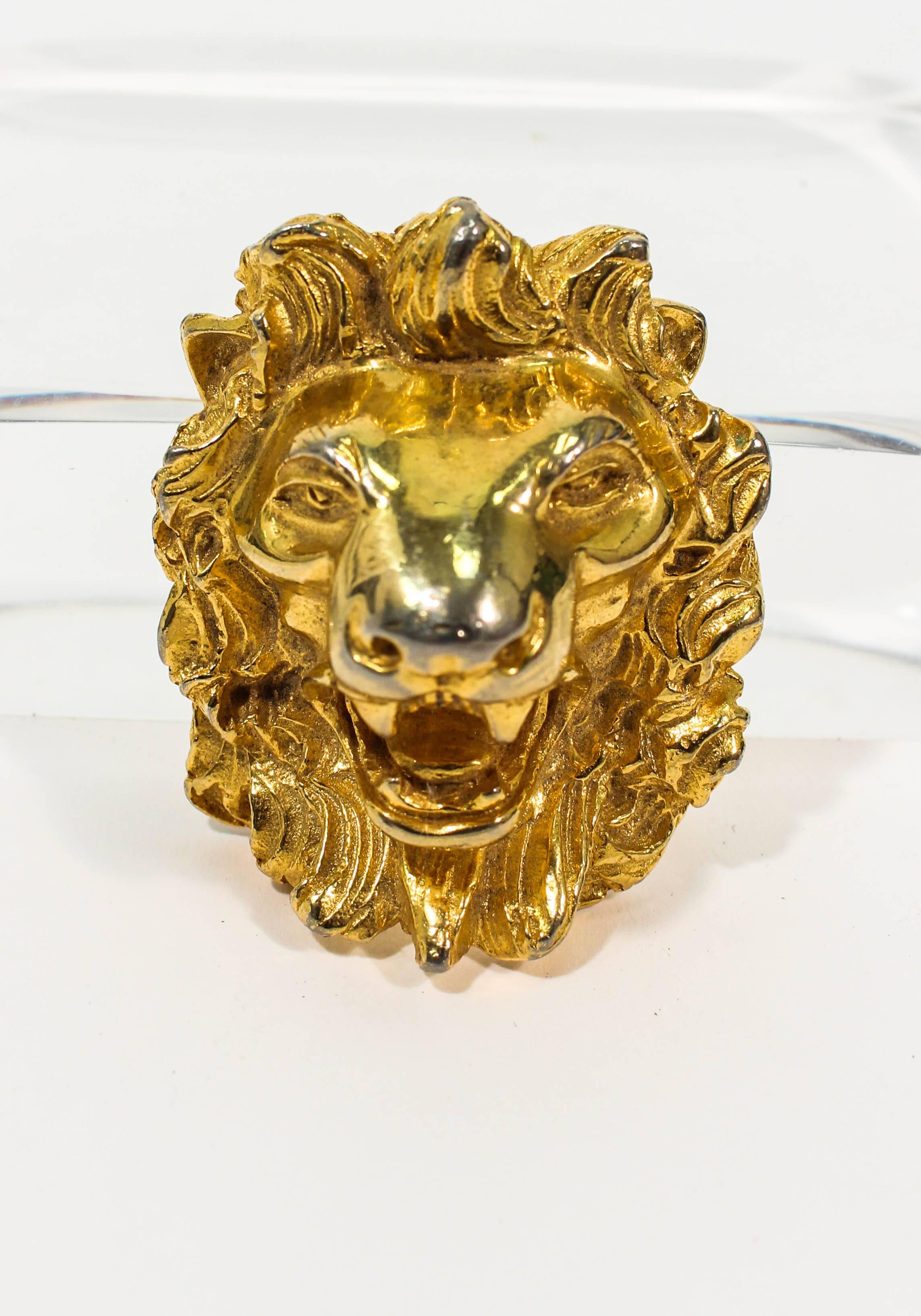 This Judith Leiber brooch is composed of a gold hue metal and can be worn as a pendant as well. In great vintage condition, shows some signs of wear and discoloration (see photos; front mouth of lions face is faded).

**Please cross-reference