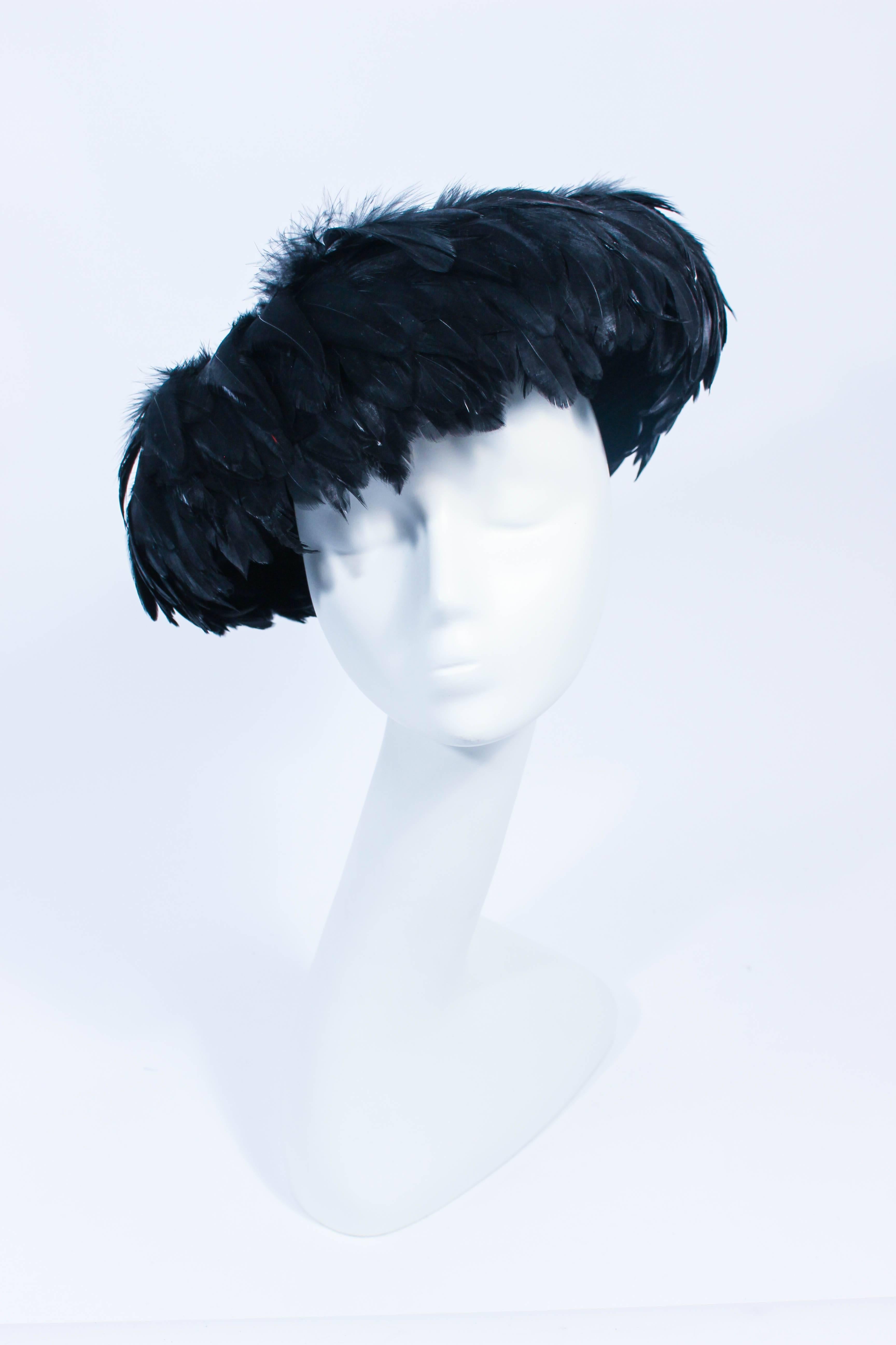 CHRISTINE Vintage 1950's Black Dyed Goose Feather and Sheared Beaver Hat.
Iconic 1950s Look that trancences contemporary fashion.
 In excellent vintage condition.

**Please cross-reference measurements for personal accuracy. Size in description box
