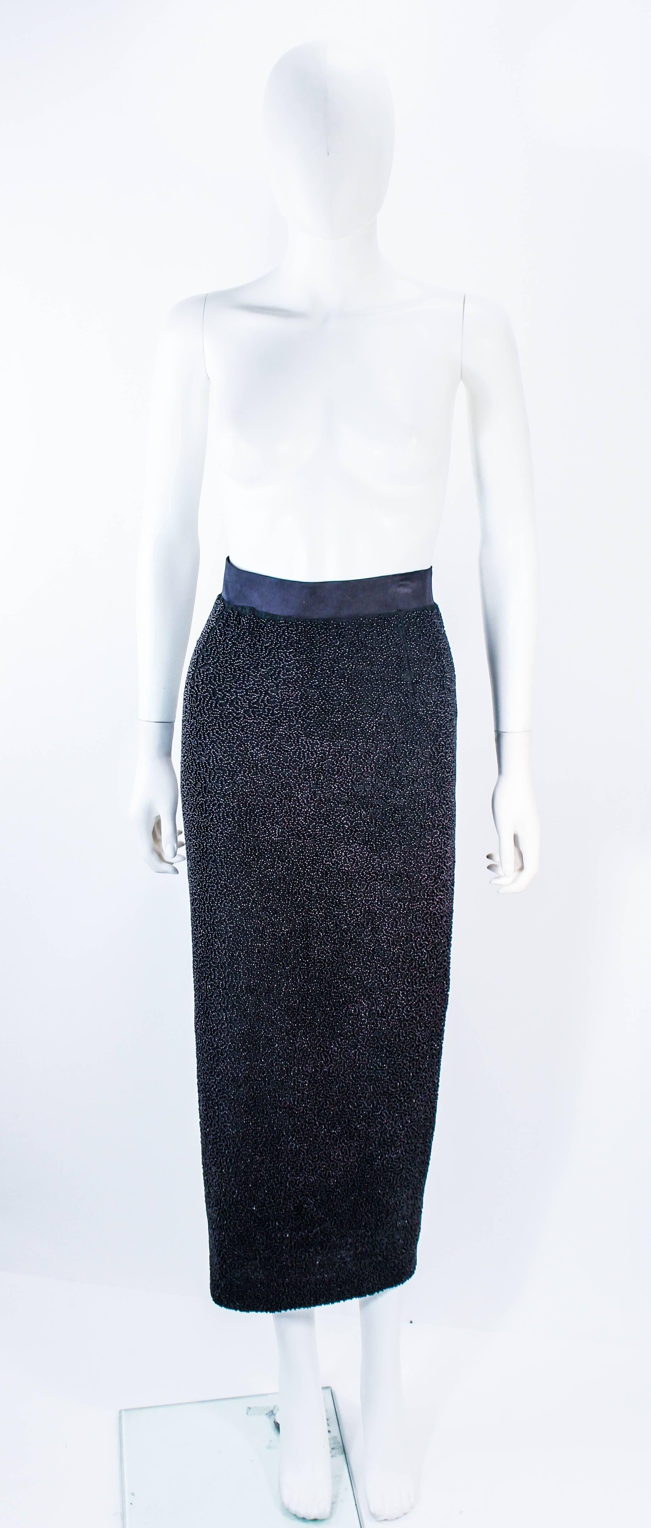 This vintage Jean Paul Gaultier skirt is composed of silk with heavy beaded applique. There is a zipper closure. In excellent vintage condition.

**Please cross-reference measurements for personal accuracy. Size in description box is an estimation.