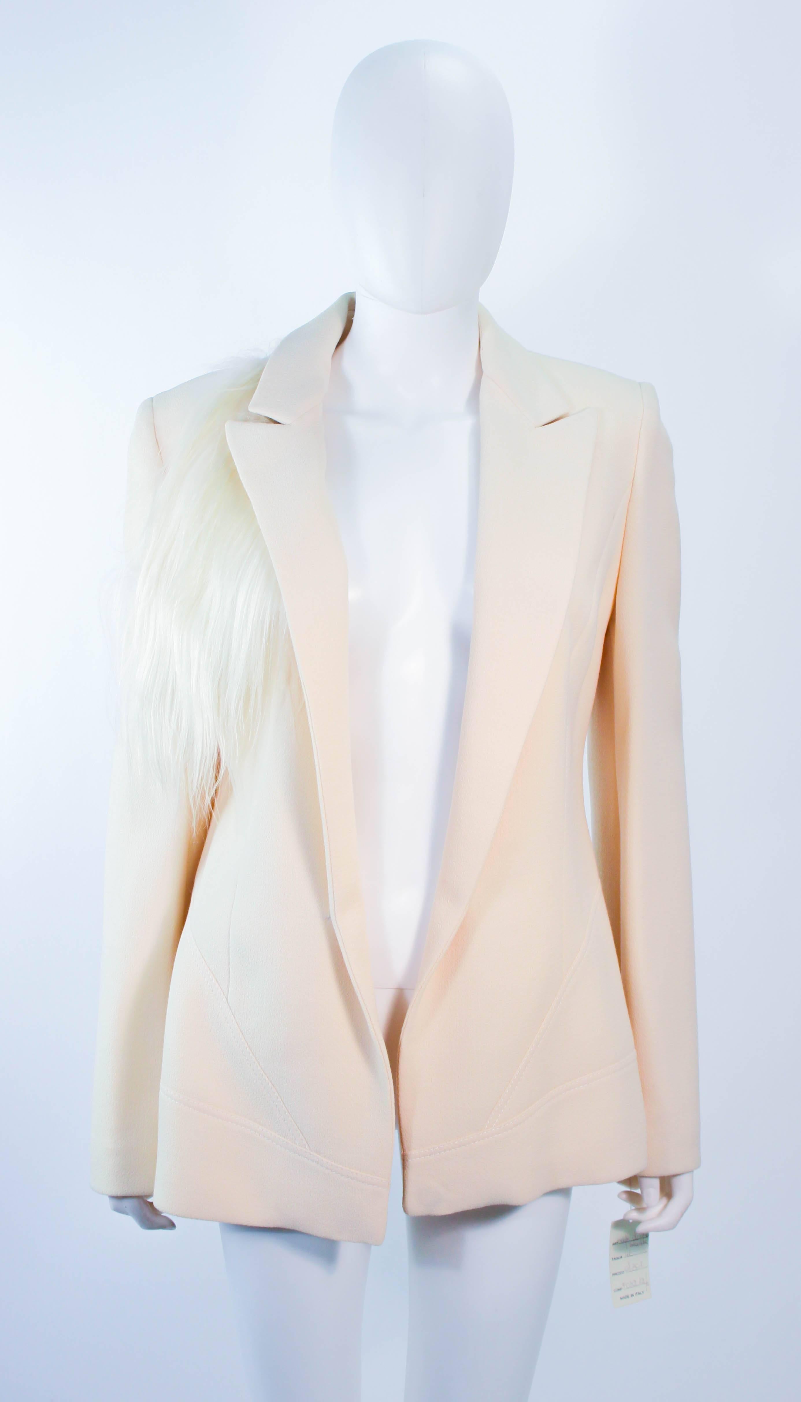 This vintage Fausto Puglisi blazer is composed of a cream silk. Features an open style with goat hair drape (that can be removed by snaps). In excellent vintage condition with original tag.

**Please cross-reference measurements for personal