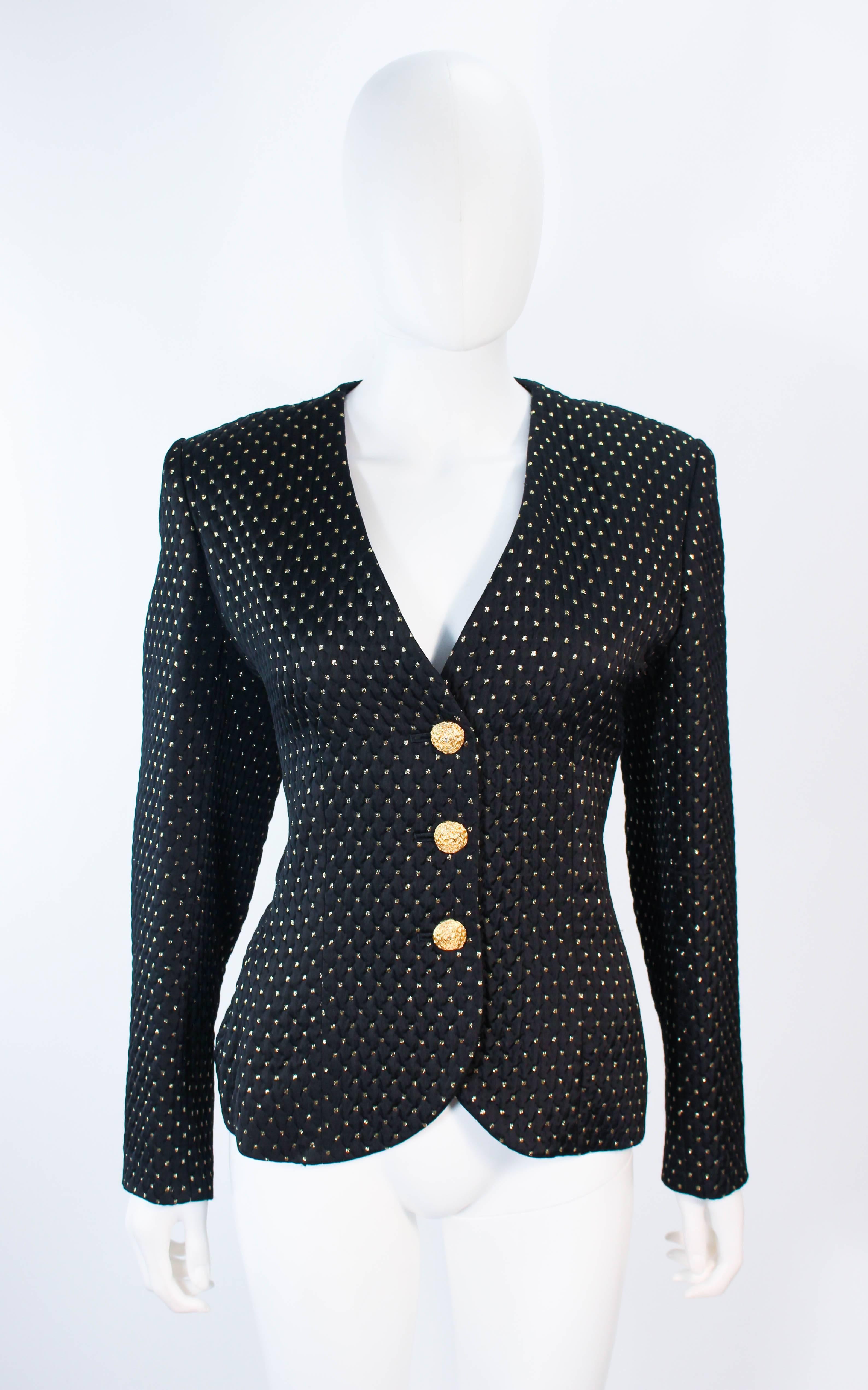 This Yves Saint Laurent jacket is composed of a black fabric with gold metallic accenting. There are center front button closures. In excellent vintage condition.

**Please cross-reference measurements for personal accuracy. Size in description box
