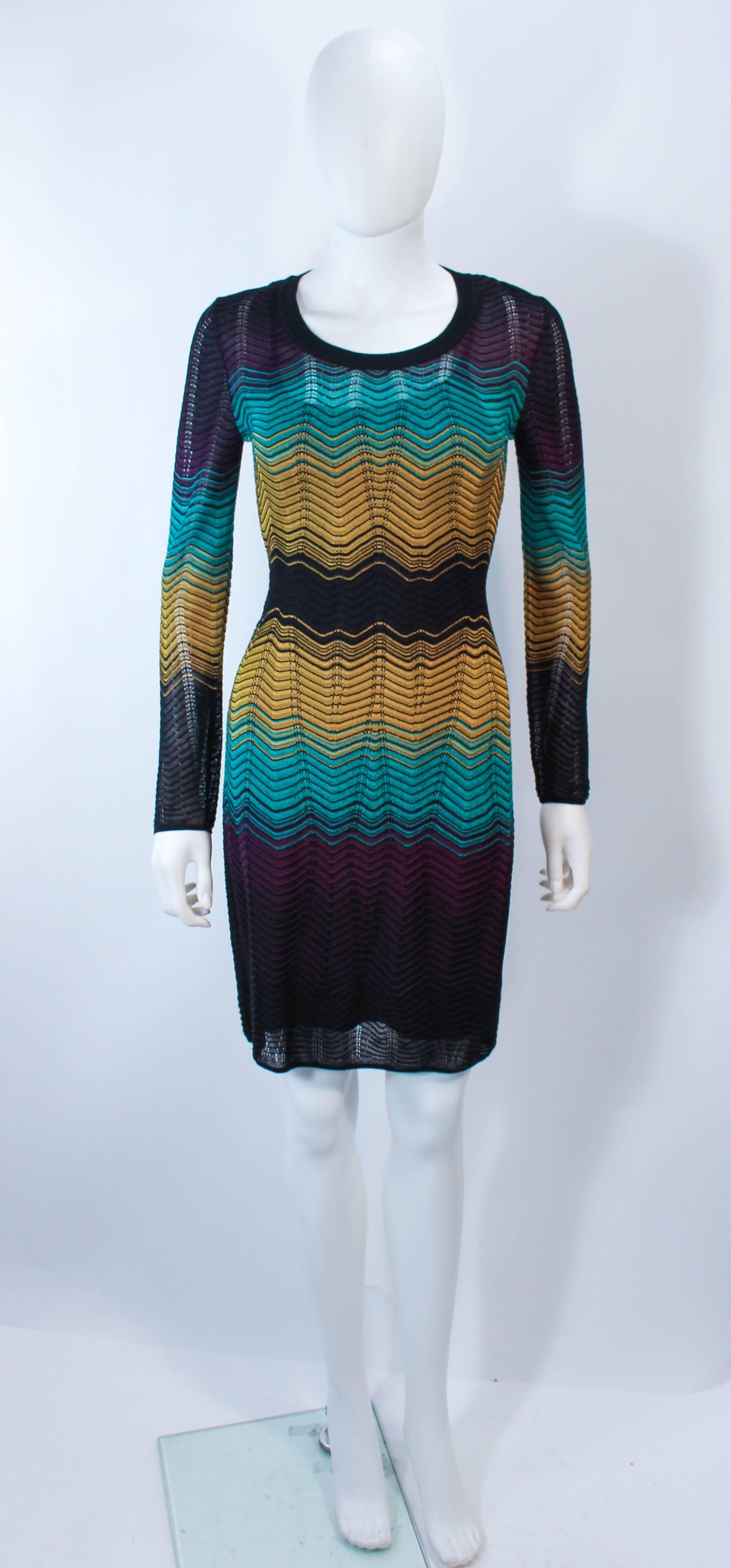 This Missoni dress is composed of a navy and mustard stretch knit. features a zig zag print and pull over style. In excellent unused condition with original tags.

**Please cross-reference measurements for personal accuracy. Size in description box