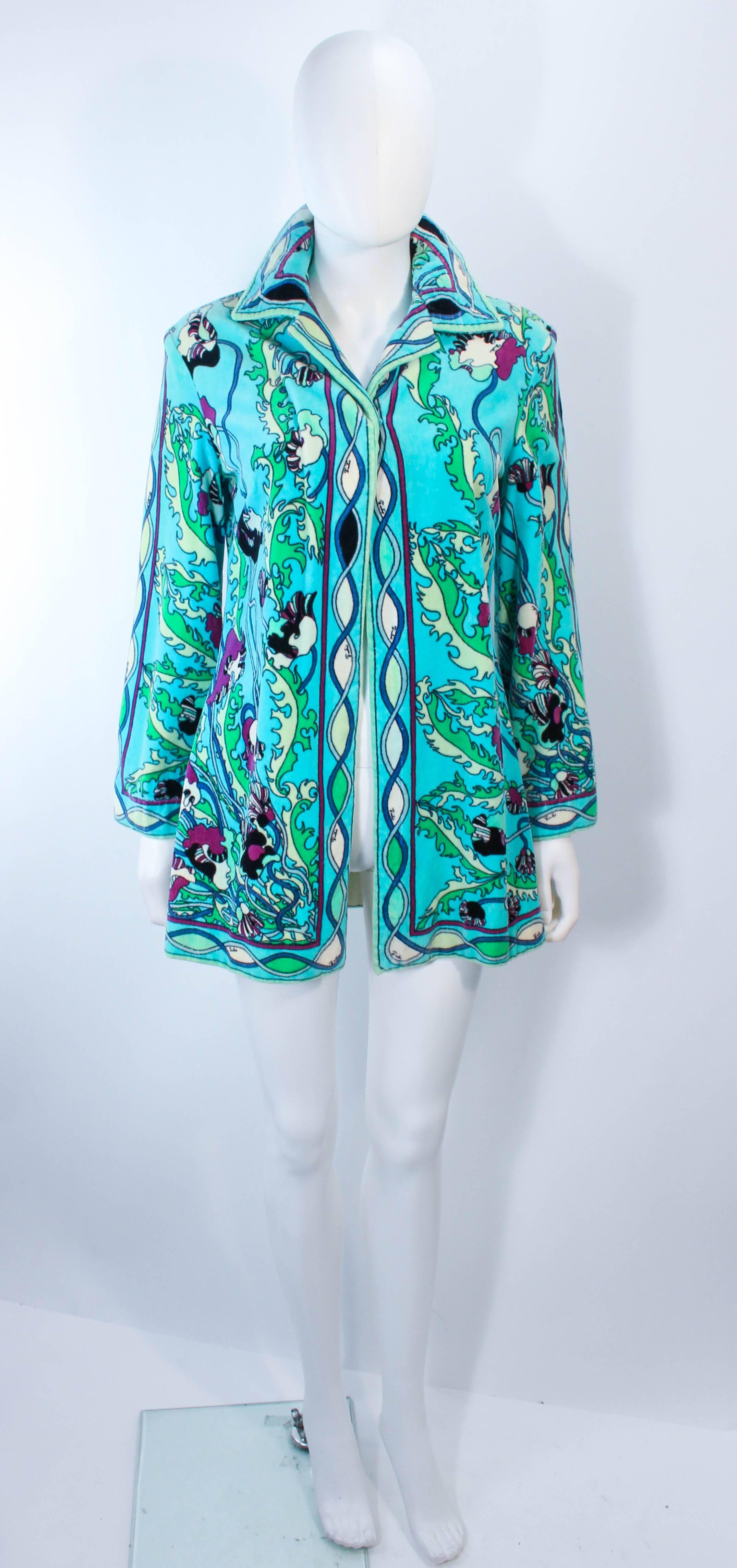 This Pucci cover up is composed of an aqua printed terry cloth velour. Features a center front snap closure and classic collar. In excellent vintage condition, some signs of wear due to age.

**Please cross-reference measurements for personal