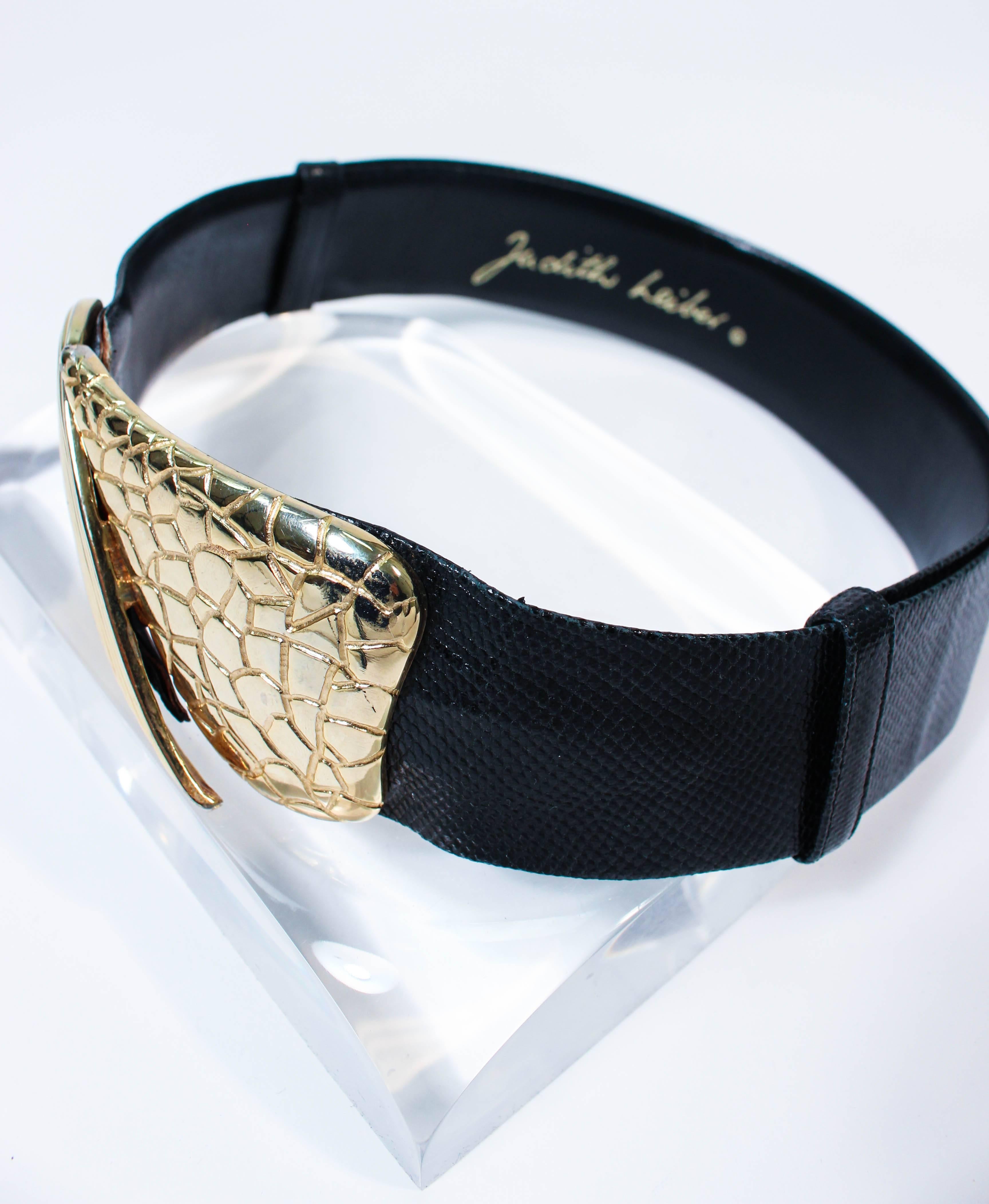 black belt with large gold buckle