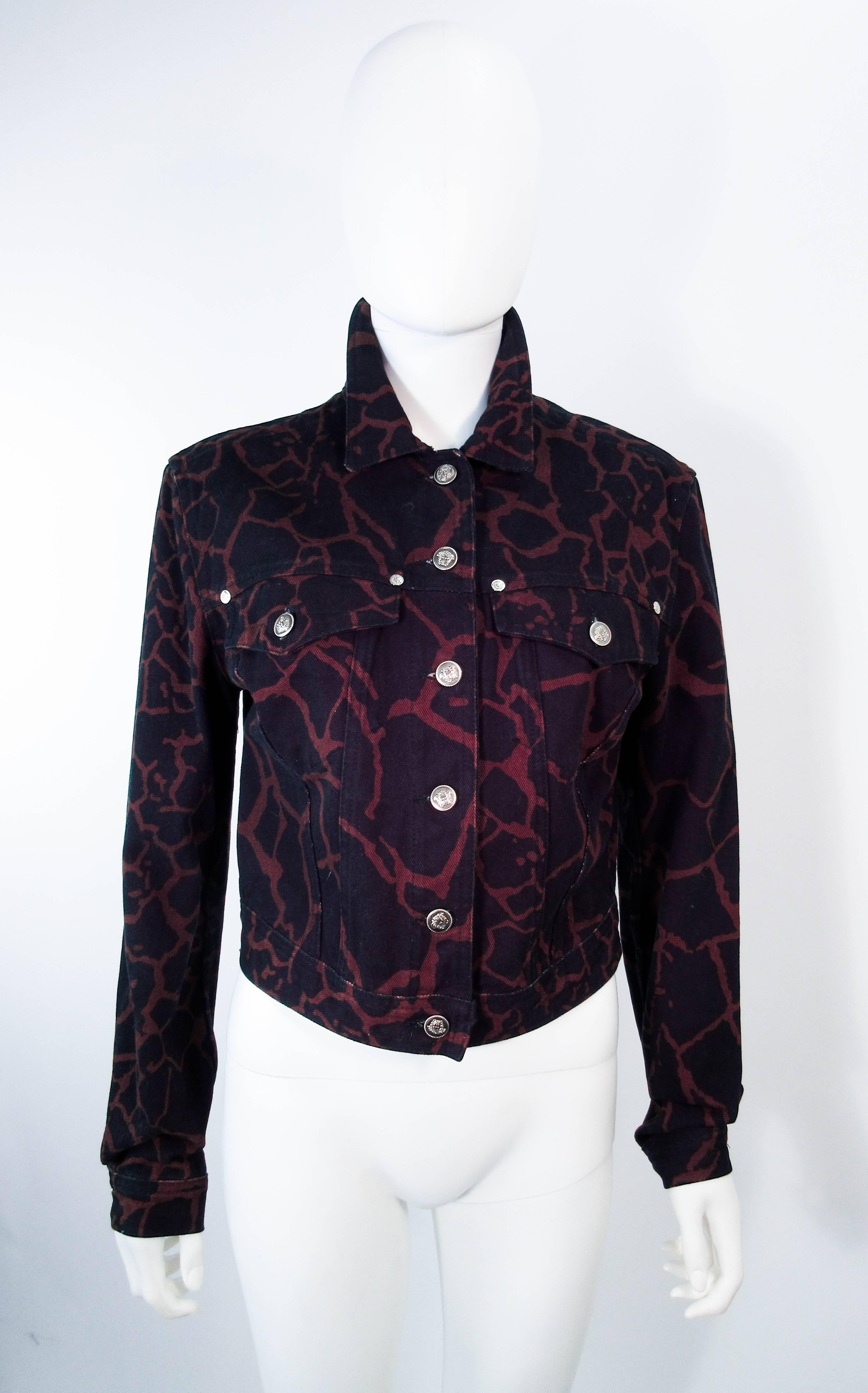 This vintage Versace jacket is composed of a giraffe print denim, 100% cotton. Features center front button closures with front pockets.. In excellent vintage condition, some signs of wear due to age and color variation. 

  **Please cross-reference