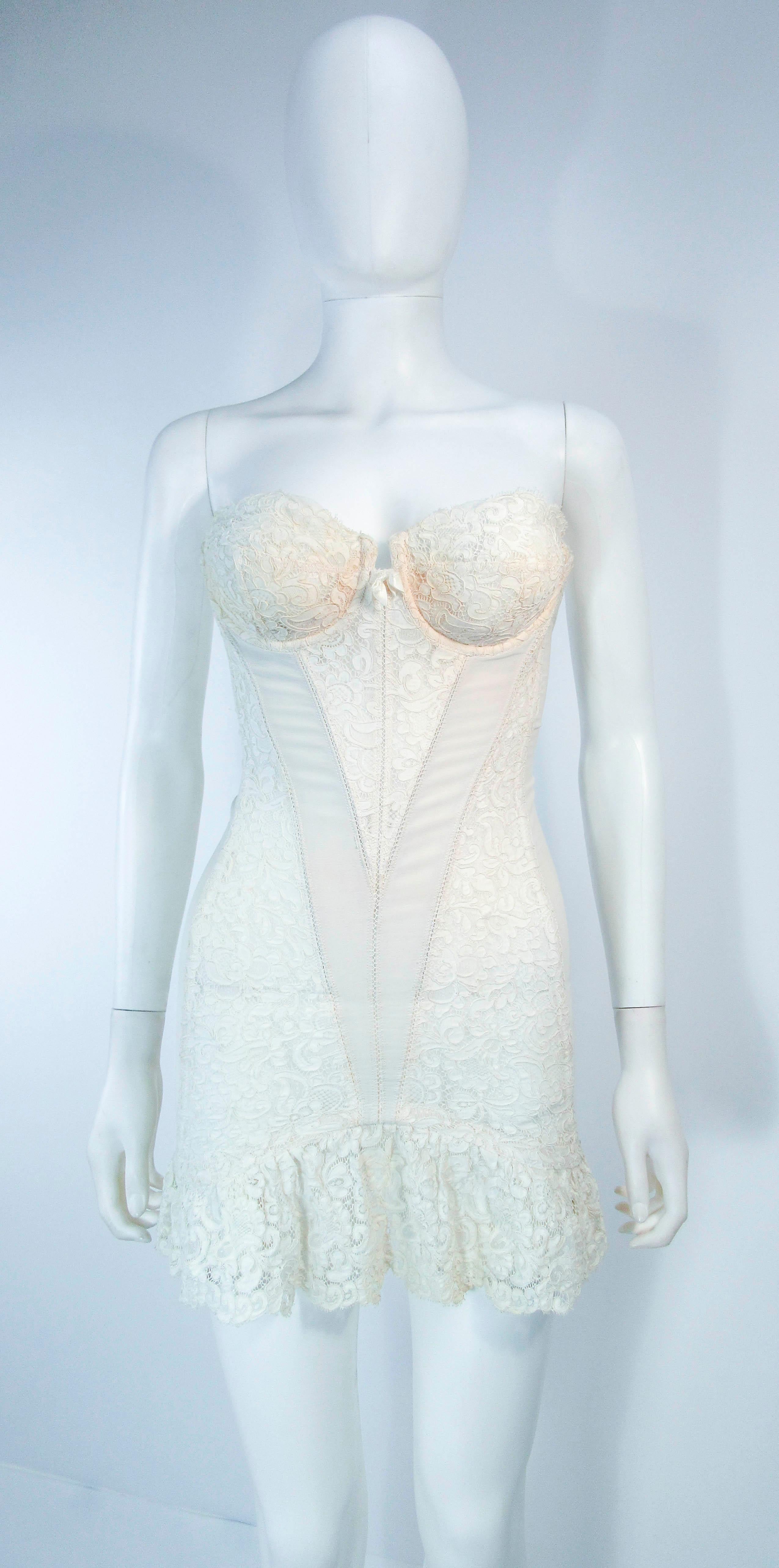 This Warners Champs Elysess Collection Merry Widow is composed of an off white stretch fabric & lace trim/accenting. There are center front hooks and eye closures. In excellent vintage condition.

**Please cross-reference measurements for personal