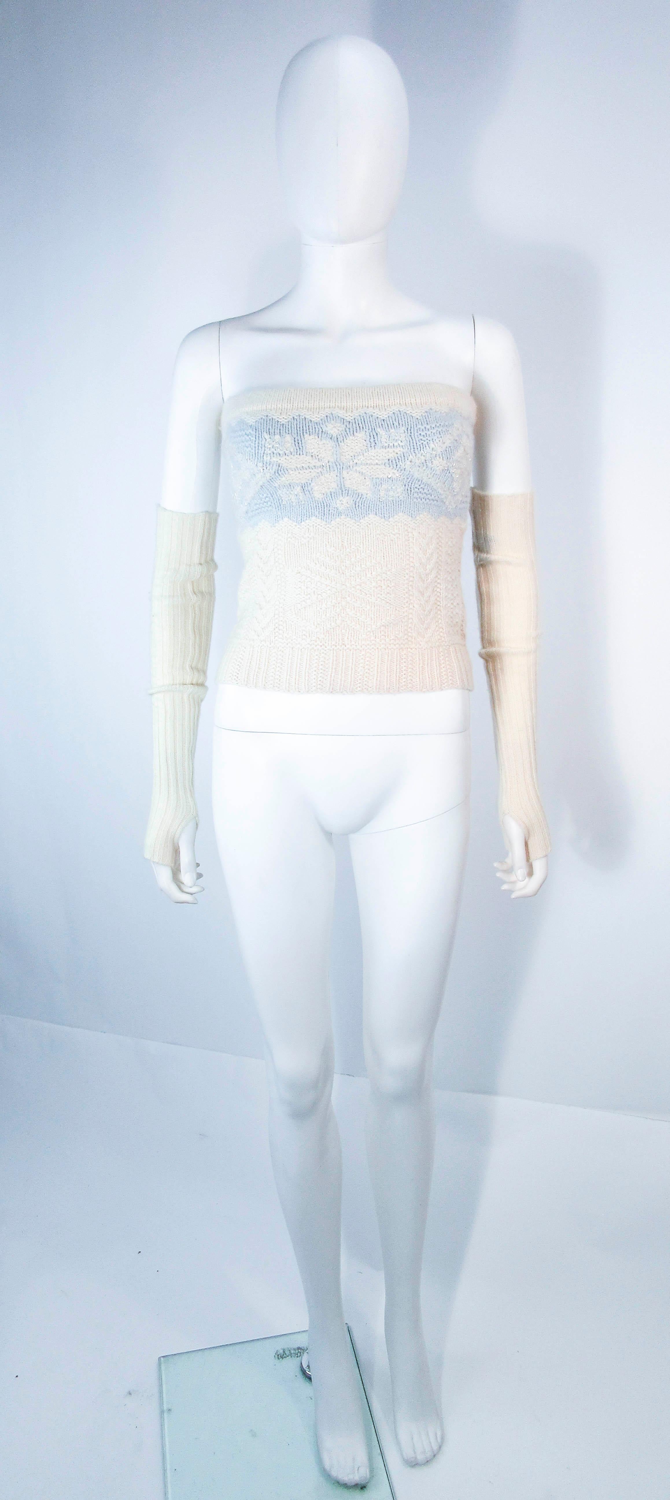 This Ralph Lauren top is composed of a cream and baby blue cashmere. Features a beaded applique and snow flakes with optional chic sleeves. In excellent condition.

**Please cross-reference measurements for personal accuracy. Size in description box