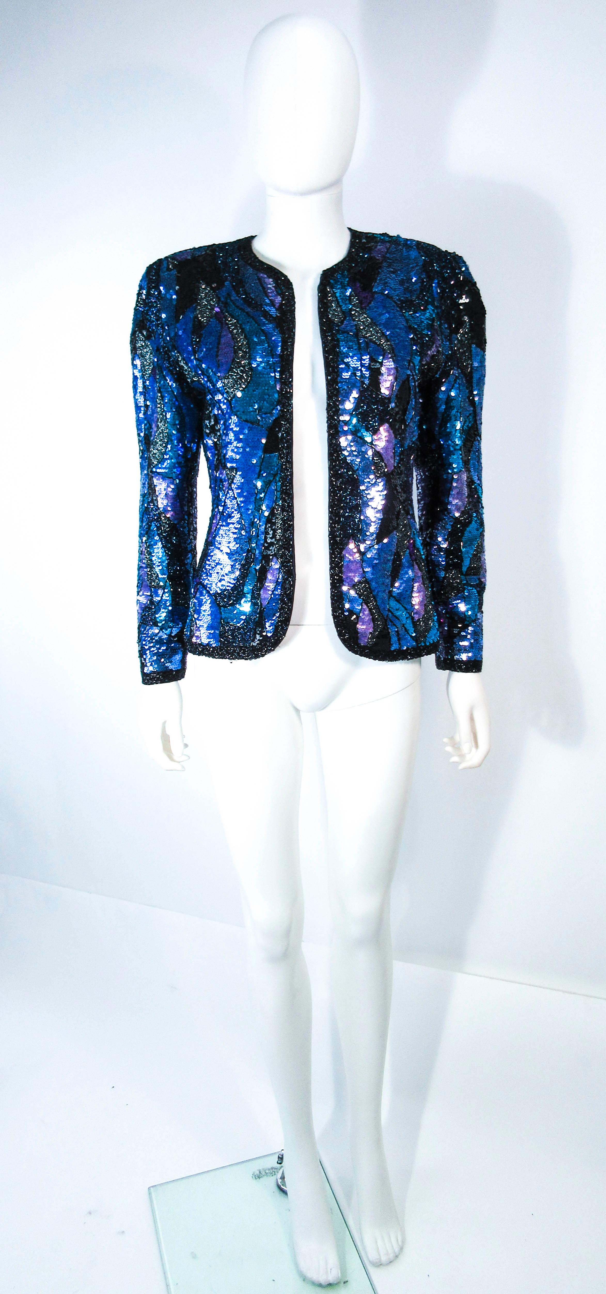 This vintage jacket is composed of an abstract pattern sequin. Features a center front opening, with no closure, but that is easy to add and left to the discretion of the buyer. In excellent vintage condition.

Bustier pictured with jacket is
