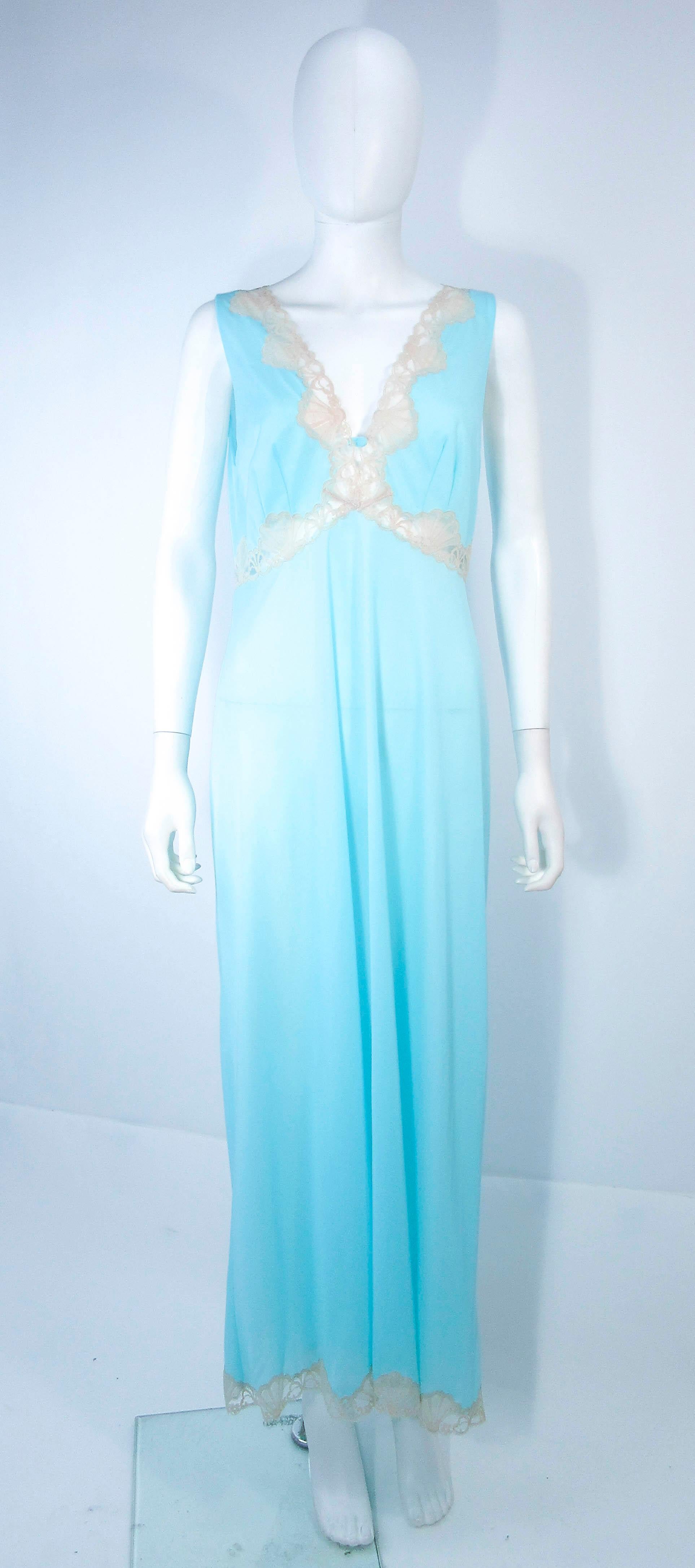 This Pucci dress is composed of a light blue poly nit with nude lace trim. Features an empire waist with a v-neck. In excellent vintage condition with original tags. 

**Please cross-reference measurements for personal accuracy. Size in description