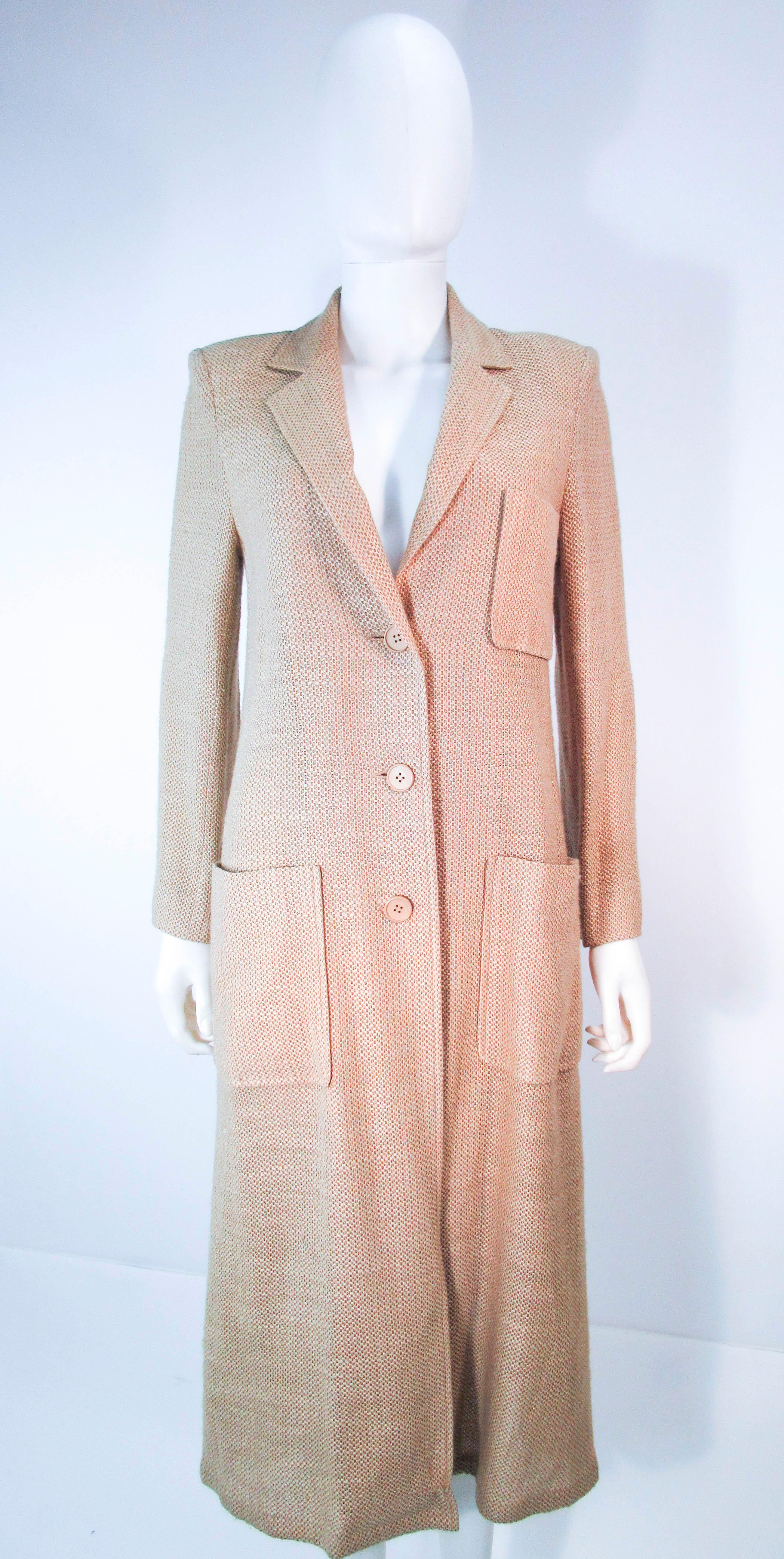 This Valentino is a wonderful design composed of light weight natural fiber in beige & nude. Features center front button closures and pockets. In excellent vintage condition (some signs of wear due to age). 

**Please cross-reference measurements