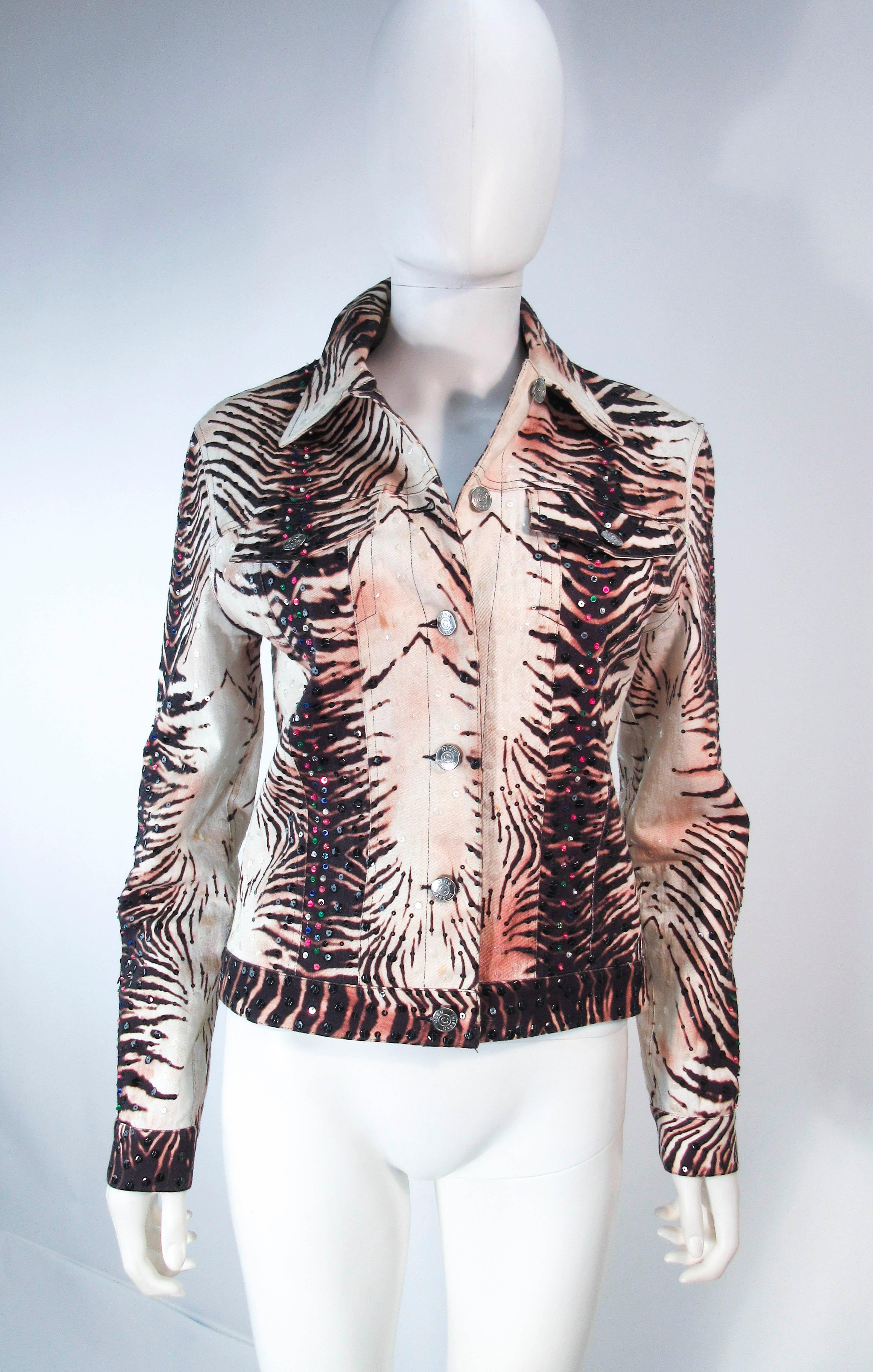 This Oleg Cassini jacket is composed of an animal print denim fabric. Features sequin applique throughout & center front zipper closure with front pockets. In excellent vintage condition, some light signs of wear due to age.

**Please