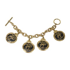 Karl Lagerfeld 1980's Gold Tone Charm Bracelet with Toggle Closure