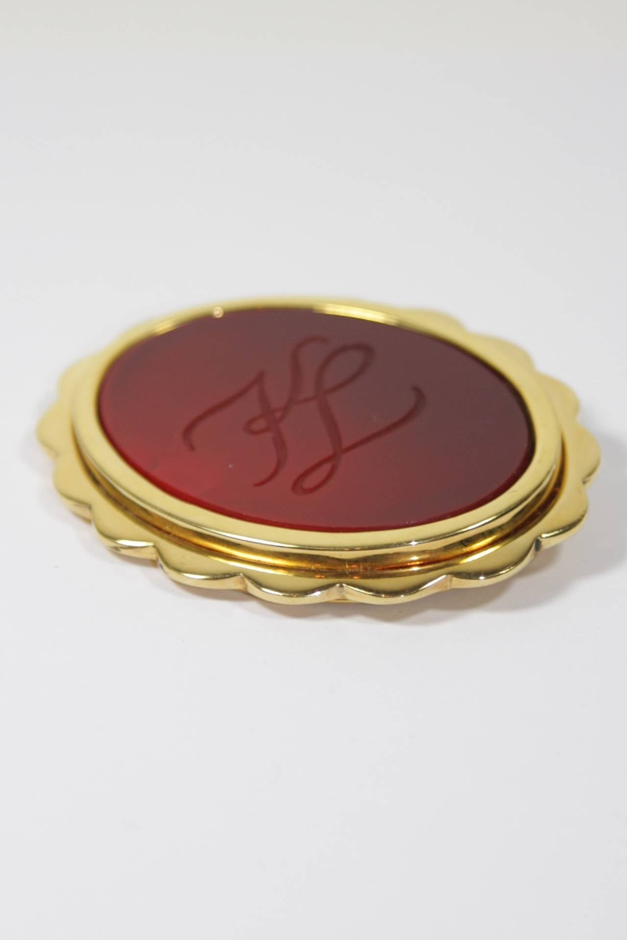 Women's Karl Lagerfield Red Glass with KL Engraved Monogram in a Gold Tone Frame Brooch