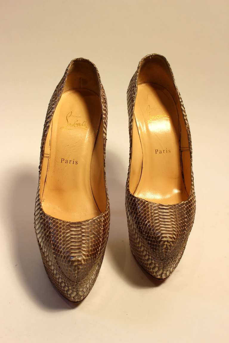 These are an amazing pair of Christian Louboutin Python heels.  

Marked size 39
Heel Height: 6.5