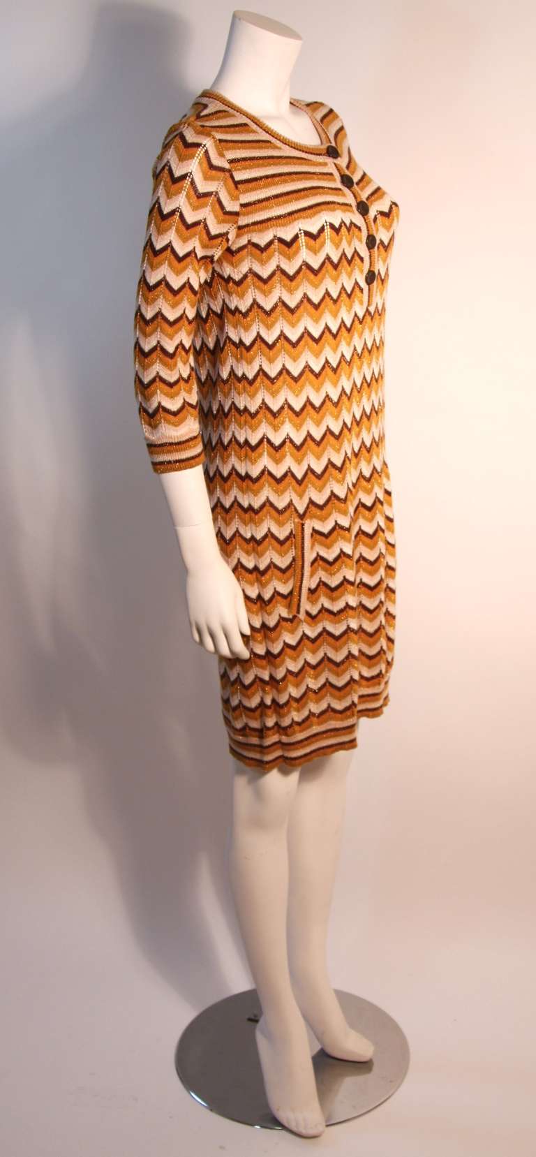 This knit dress is fashioned by Missoni. It has wonderful neutral hues with a hint of metallic threading. 

Measurements (Approximate):
Length (Back of Neck to Hem): 37