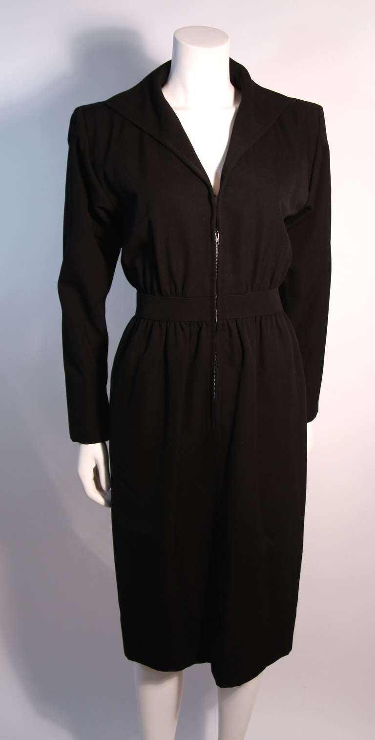 This is a Yves St. Laurent Rive Gauche dress. It features a front zipper, long sleeves, and classic design. 

Measurements (Approximate):
Length (Back of Neck to Hem): 44