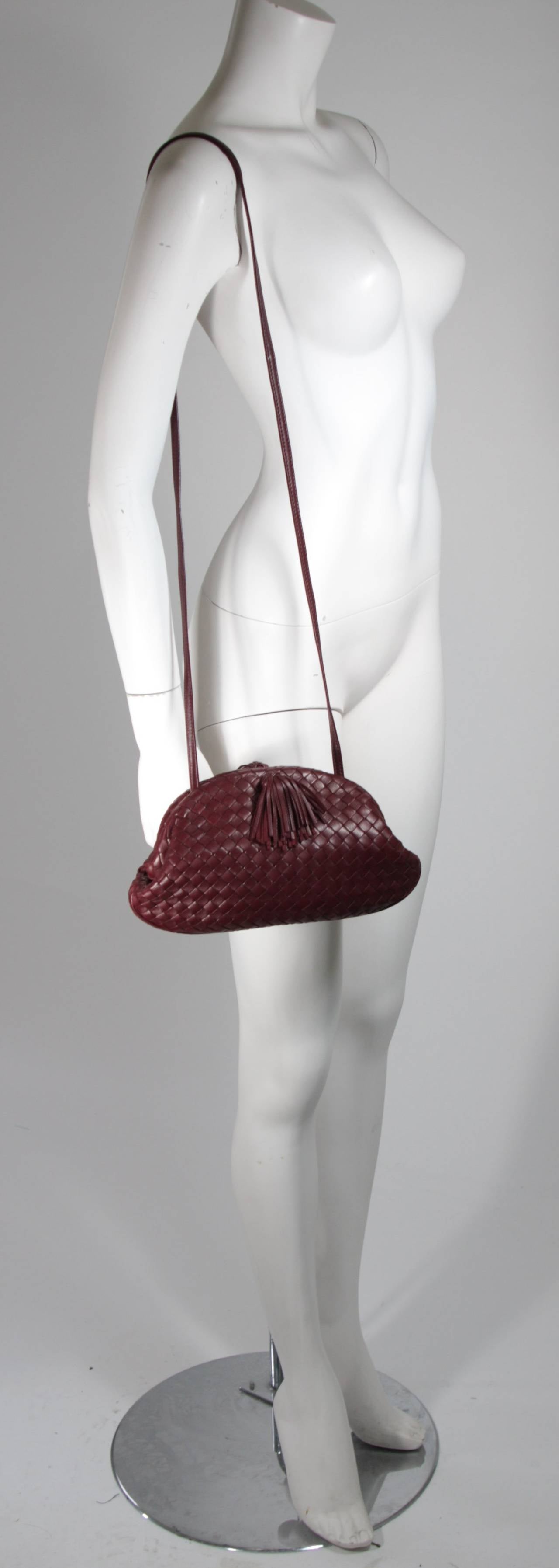 Bottega Veneta Vintage Burgundy Leather Clutch with Strap and Tassel Detail In Excellent Condition In Los Angeles, CA