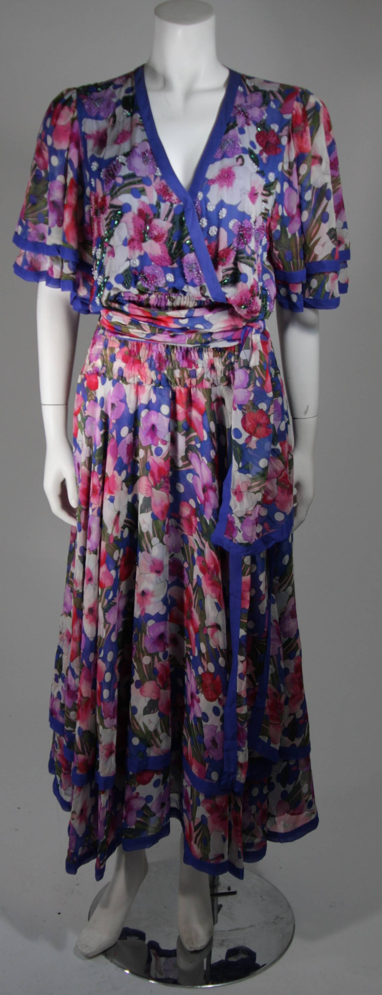This Diane Freis design is available for viewing at our Beverly Hills Boutique. We offer a large selection of evening gowns and luxury garments.

This maxi dress is composed of a floral print silk chiffon. The dress has a v-plunge neckline which