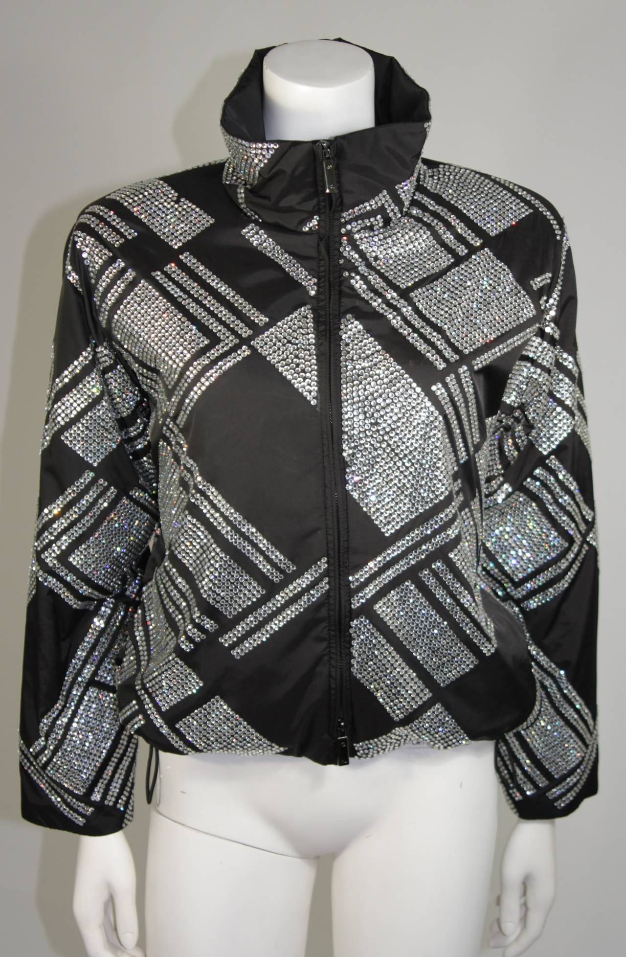 This Ralph Lauren design is available for viewing at our Beverly Hills Boutique. We offer a large selection of evening gowns and luxury garments.

This jacket is composed of a nylon and is embellished with rhinestones in a geometric form. There is