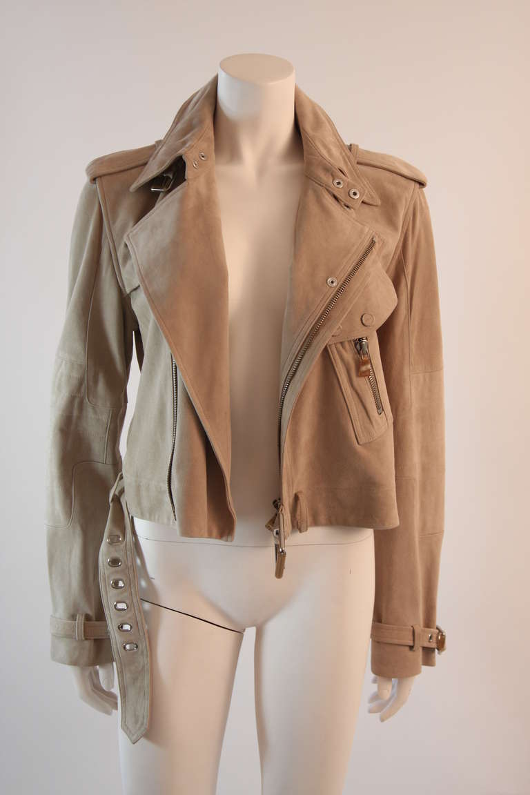 This is a great Moto style jacket by Ralph Lauren. This super supple jacket is designed with most amazing and soft goat skin. It features an asymmetrical zip and belting details. 

Measures (approximate)
Size 12
Length: 19.5
