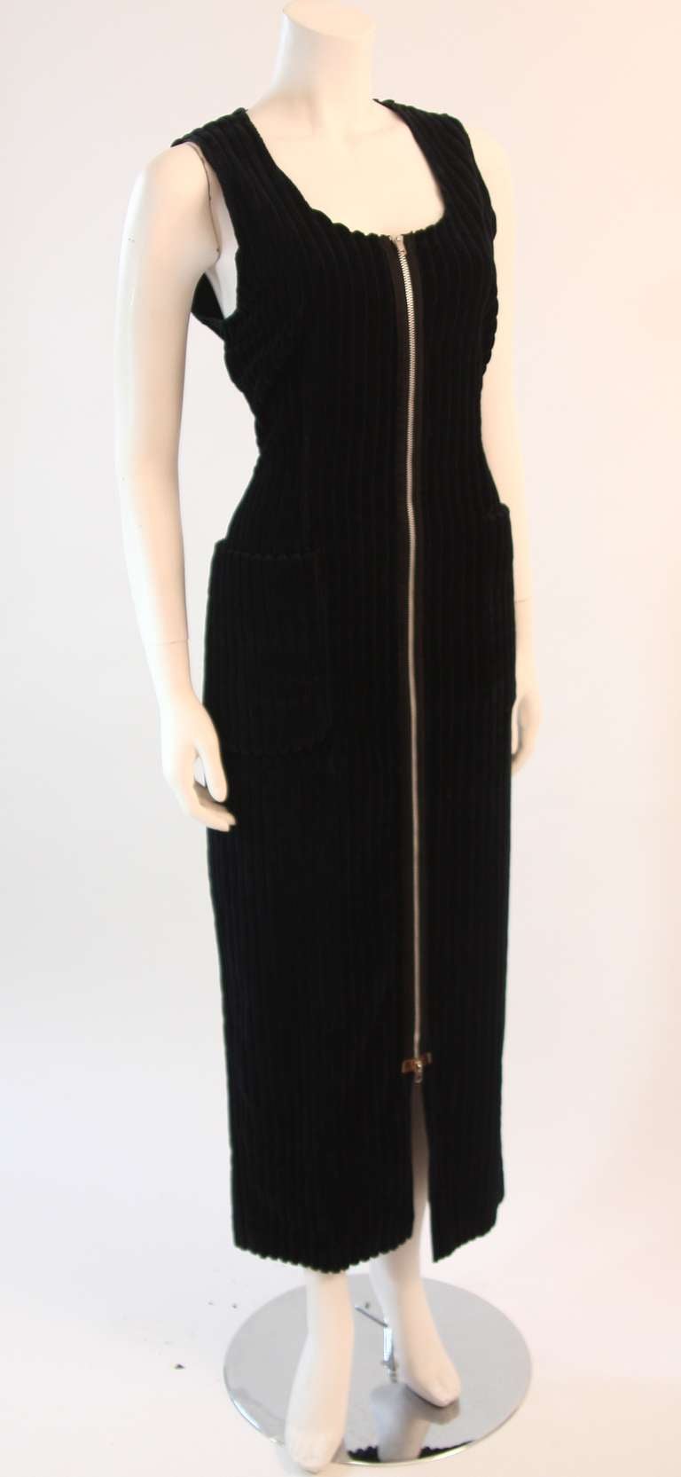This is an intriguing Maison Martin Margiela design. It features two front pockets and a full length center front zipper.  It can be worn fully zipped as a dress or even styled as a full length vest. Very chic!

Measures (approximate)
Length: 54