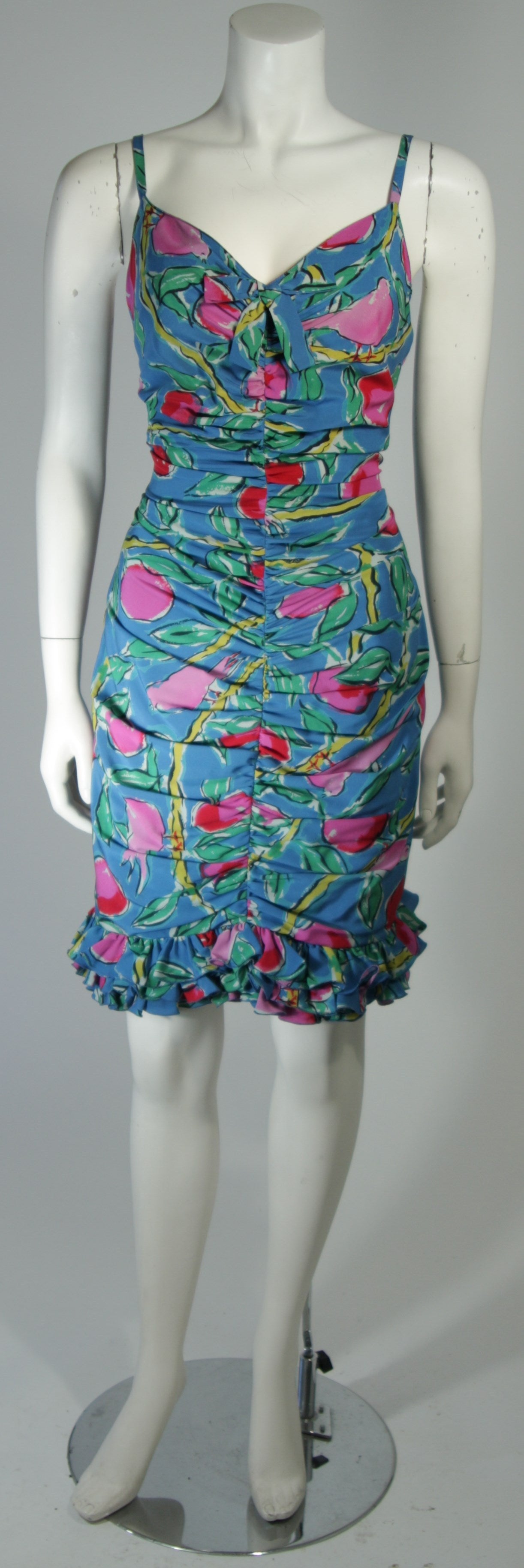 This Ungaro design is available for viewing at our Beverly Hills Boutique. We offer a large selection of evening gowns and luxury garments.

This cocktail dress is composed of a tropical print silk with a bird motif. There are spaghetti straps and
