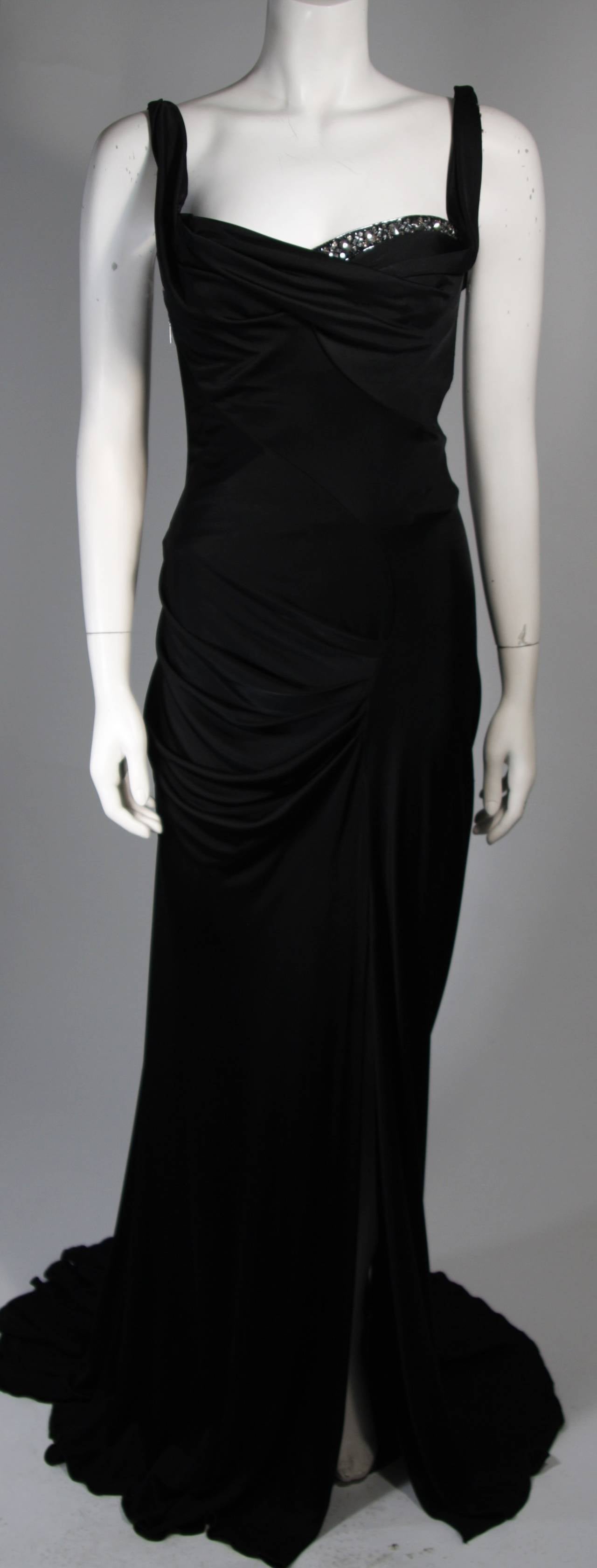 This Roberto Cavalli design is available for viewing at our Beverly Hills Boutique. We offer a large selection of evening gowns and luxury garments.

This gown is composed of a black stretch jersey and features rhinestone adornments along the