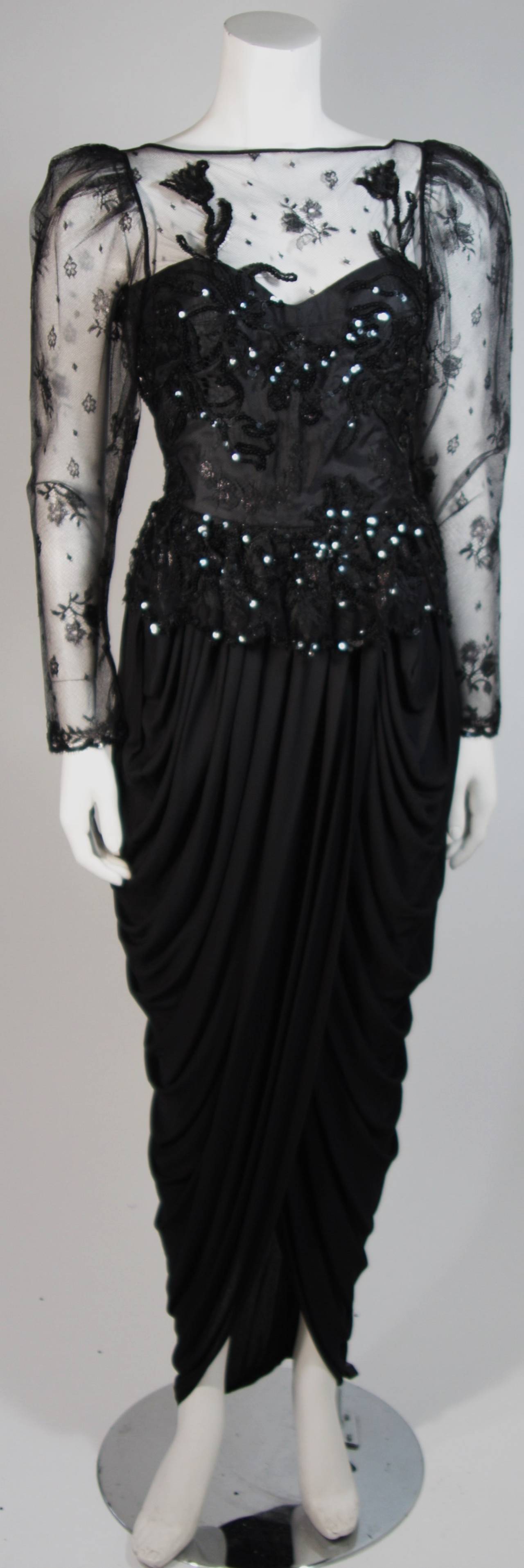 This Vicky Tiel gown is composed of a black sequined lace and a draped jersey skirt. The bodice features boning for structure and there is a center back zipper closure for ease of access. In excellent condition. Made in France.

This item is from