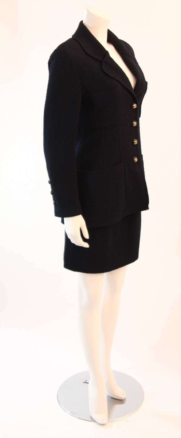 Women's 1993 C Chanel Navy Boucle Jacket and skirt suit with CC logo buttons