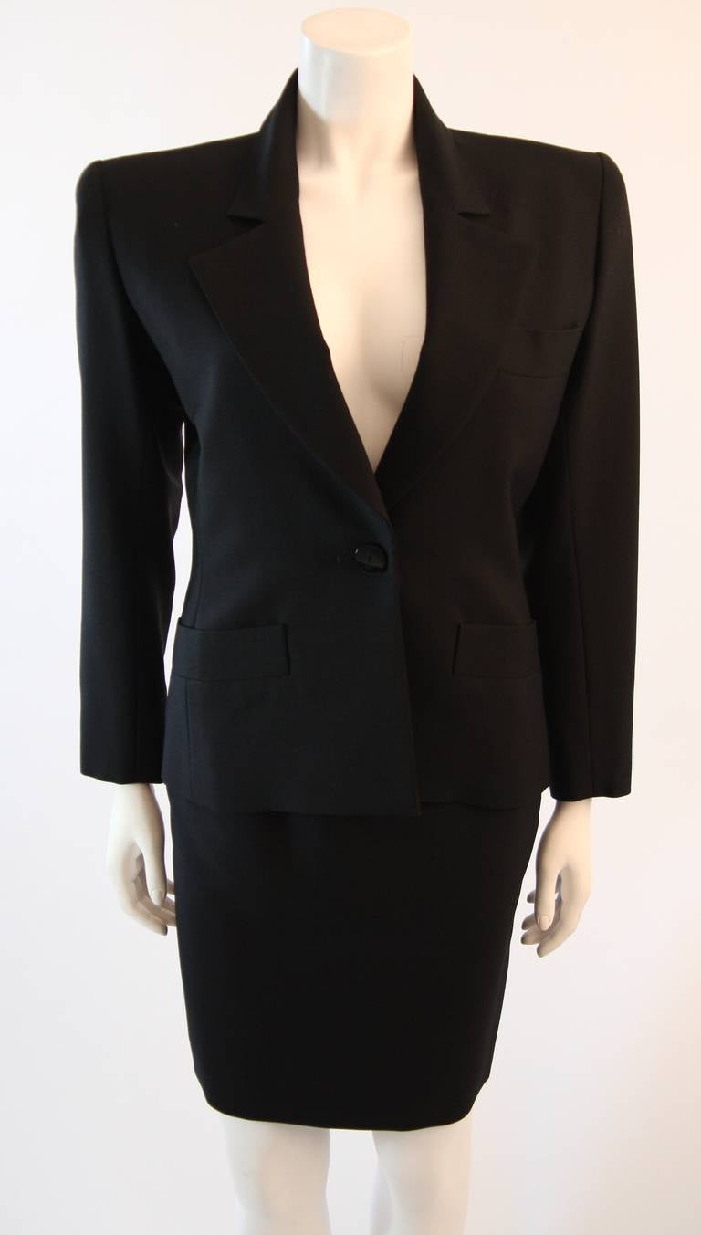 This is a great Yves Saint Laurent skirt suit. This suit is composed of a beautiful wool mohair blend. Featuring a gorgeous shawl collar design and pencil skirt. The jacket has front button closure and three pockets. The skirt is an amazing classic