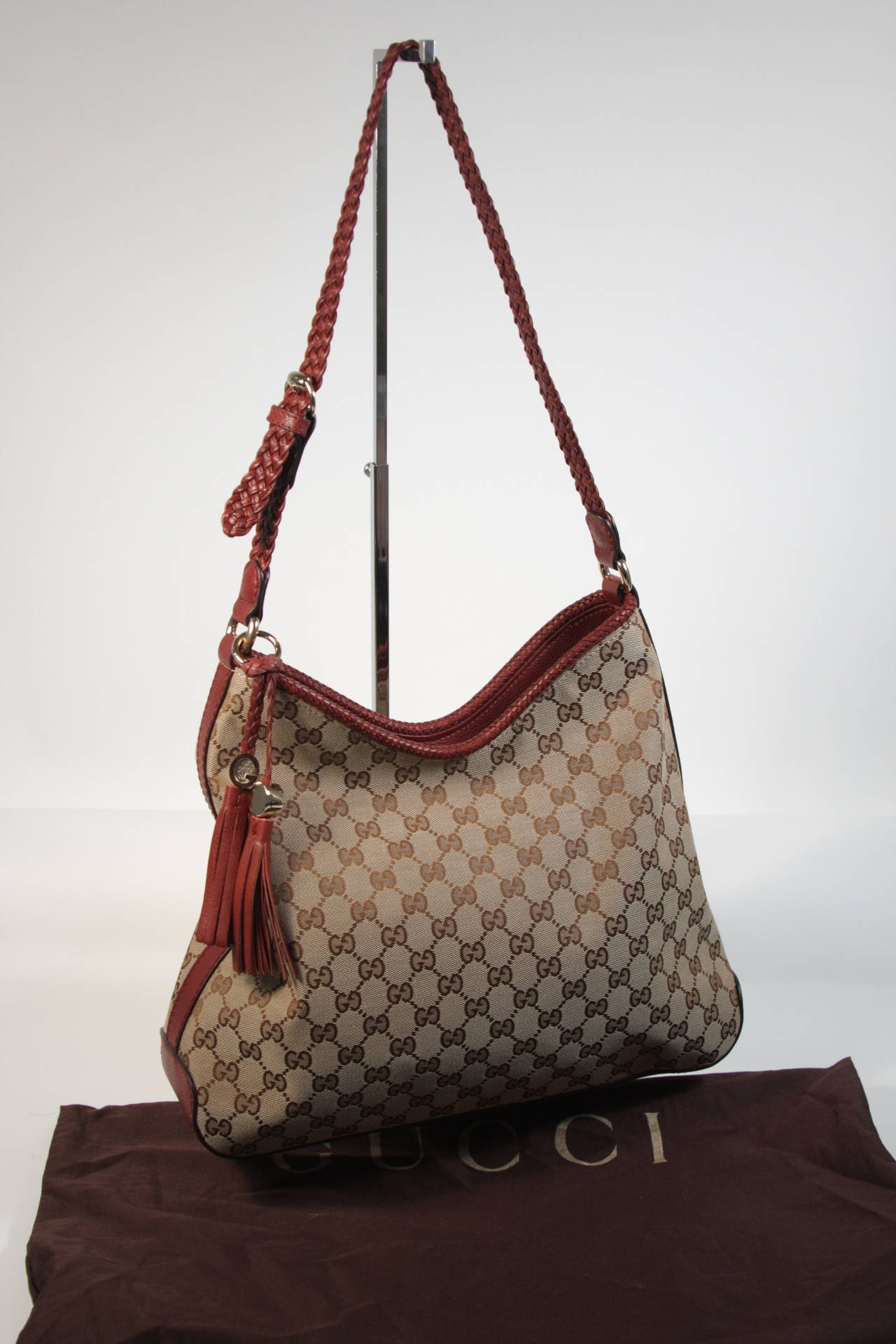 Gucci Canvas Logo Hobo Style Purse with Tassel For Sale at 1stDibs