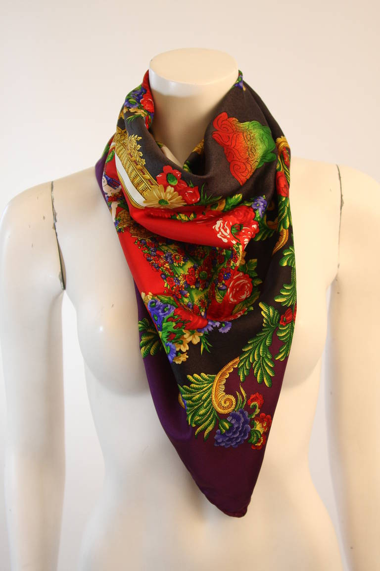 This is a Versace scarf. It its composed of a beautifully colored silk. Features three women wioth a fruit and floral motif. Made in Italy.

Measures (Approximately)
35