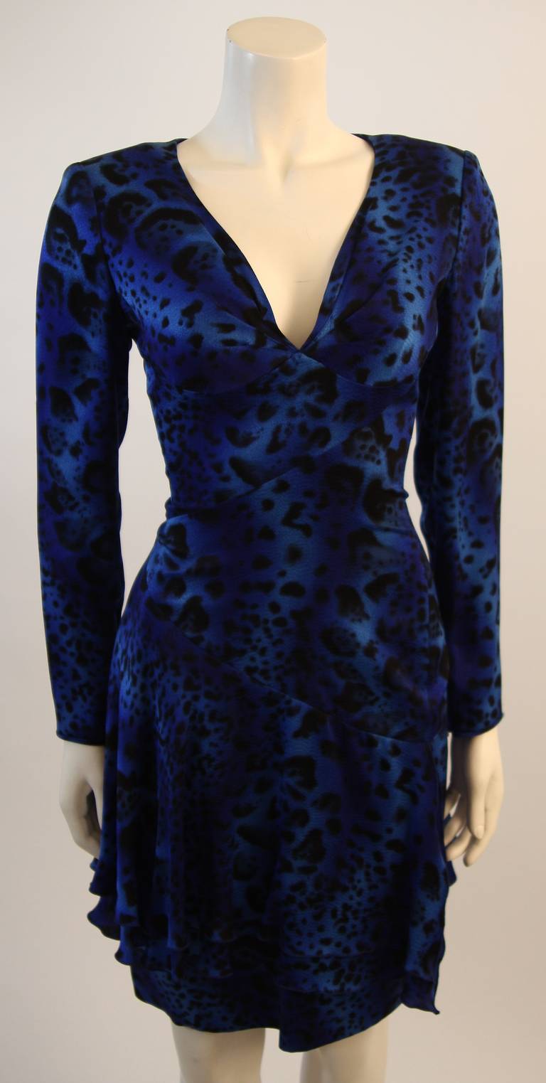 This is a fabulous Emanuel Ungaro design. This gorgeous dress is composed of a stunning blue silk with an abstract animal print. There are zippers at the center back, side, and sleeves for ease of access. Made in Italy. 

Measures