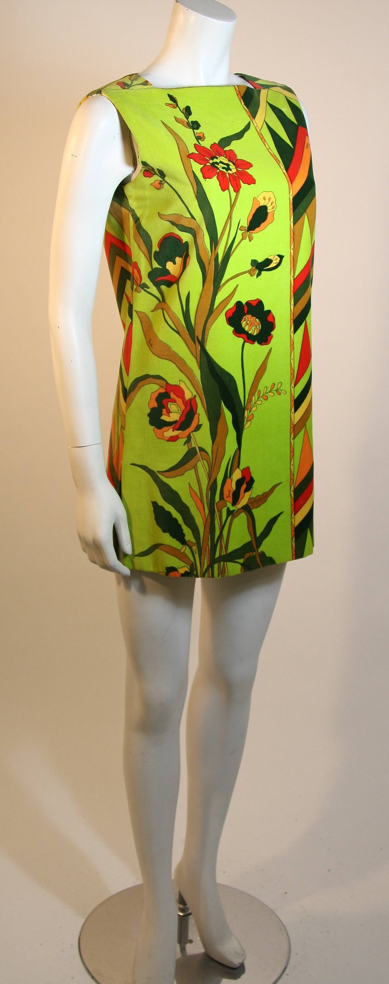 This is an Emilio Pucci design. This wonderful shift dress is composed of a multi-colored velvet with a floral design/artwork. It is a pull-over style dress. Made in Italy.

Measures (Approximately)
Length: 30