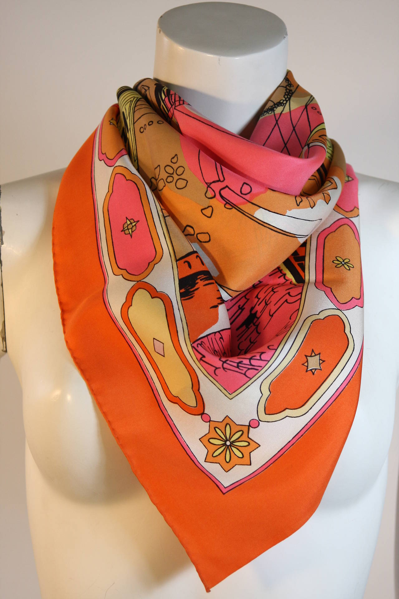 Gorgeous and rare Emilio Pucci Florentine citry scape in shades of orange, pink, and black with cream border detail print. In excellent condition with little  signs of use.

Measurements-
36 x 35

Please note only 2 edges are hand rolled which