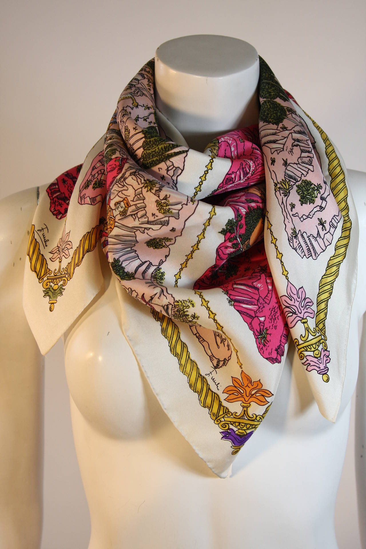 Cream silk twill scarf with an incredibly rare print of a royal feast. The colors are rich and vibrant shades of deep to pale pink with a beautiful gold border.

35