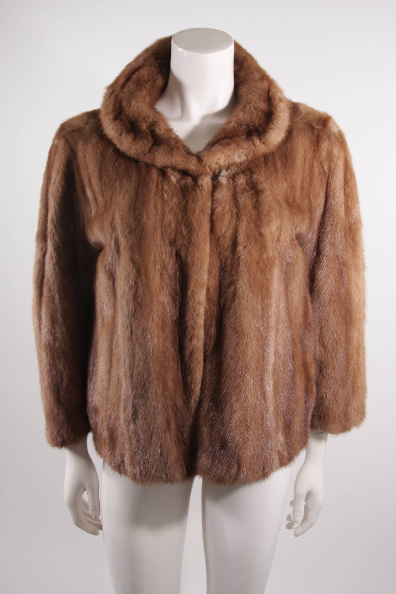 This is a Christian Dior for Holt Renfrew & Co. coat. The lovely mink stroller features two front closures with bracelet length sleeves and a wonderful collar. The jacket is monogrammed. Made in Canada. 

Measures (Approximately)
Length: