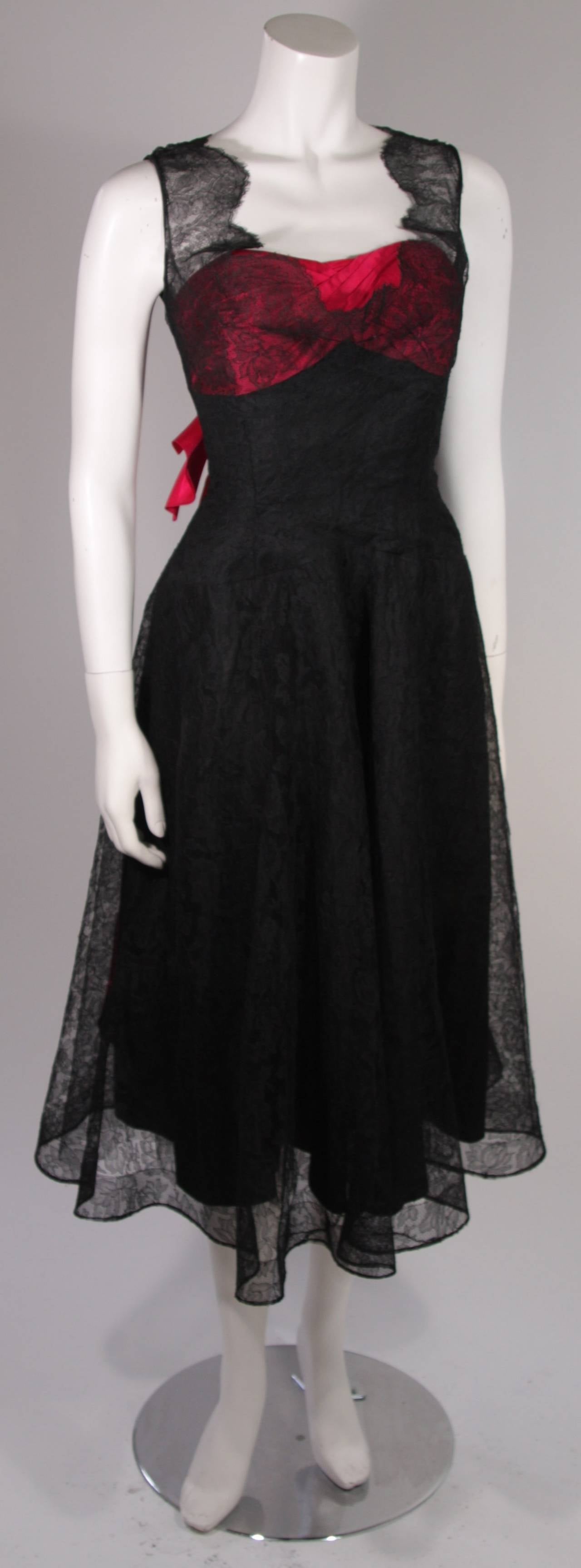 This beautiful Ceil Chapman cocktail dress is composed of a gorgeous black lace with an accented magenta bust and large silk bow. Absolutely gorgeous. 

Measures (Approximately)
Length: 39.5