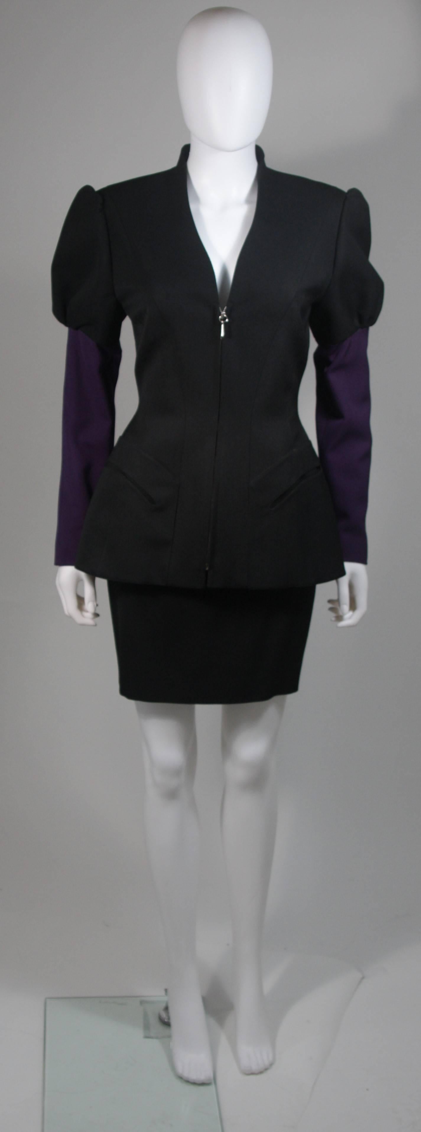  This skirt suit is composed of a black and purple fabric combination. The jacket has a center front zipper closure. The skirt has a classic pencil silhouette with zipper closure. In excellent vintage condition. Made in France. 

  **Please