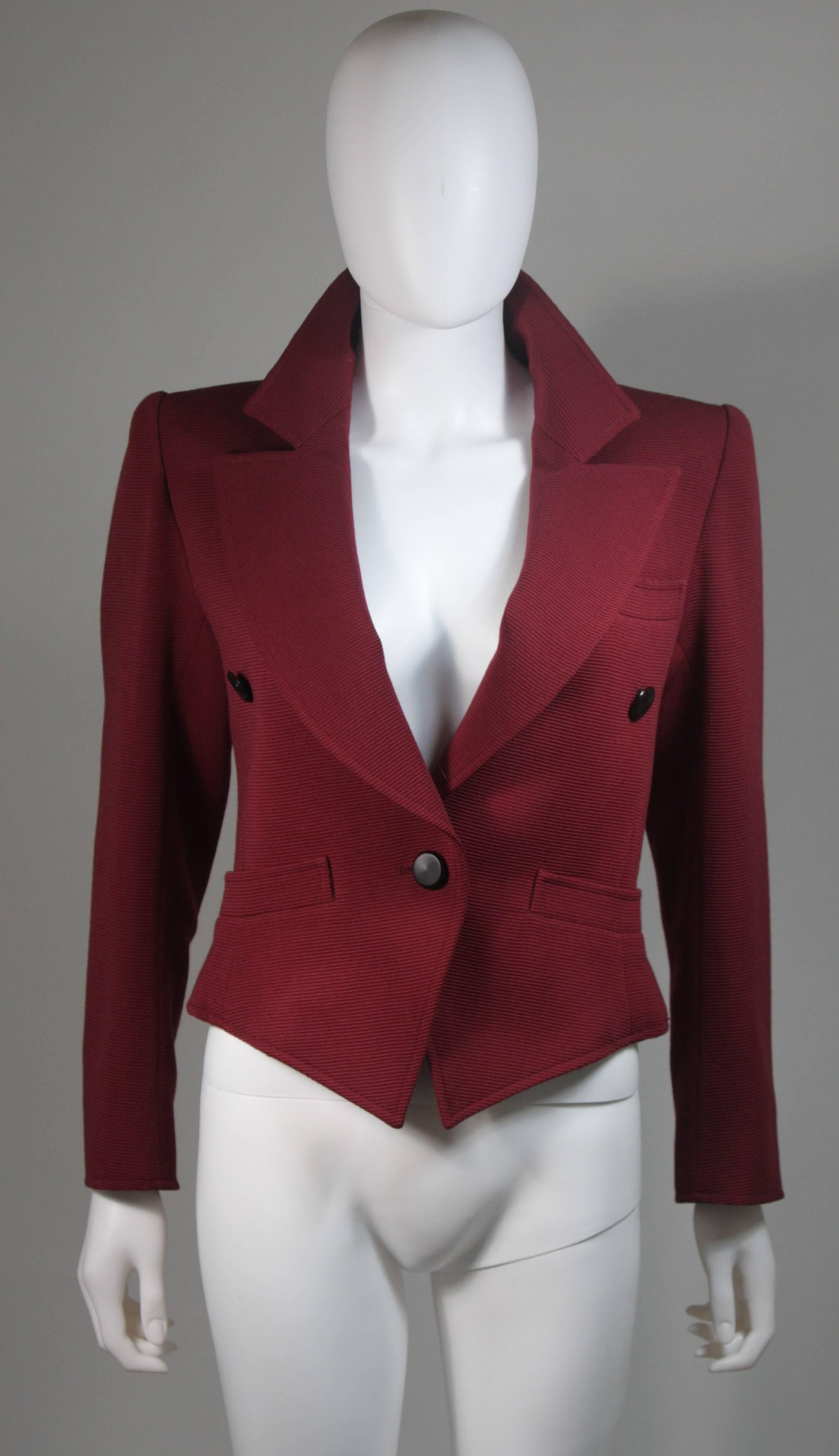 This jacket is composed of a burgundy fabric. Features front pockets and a center front button closure. In excellent vintage condition. Made in France. 

  **Please cross-reference measurements for personal accuracy. Size in description box is an
