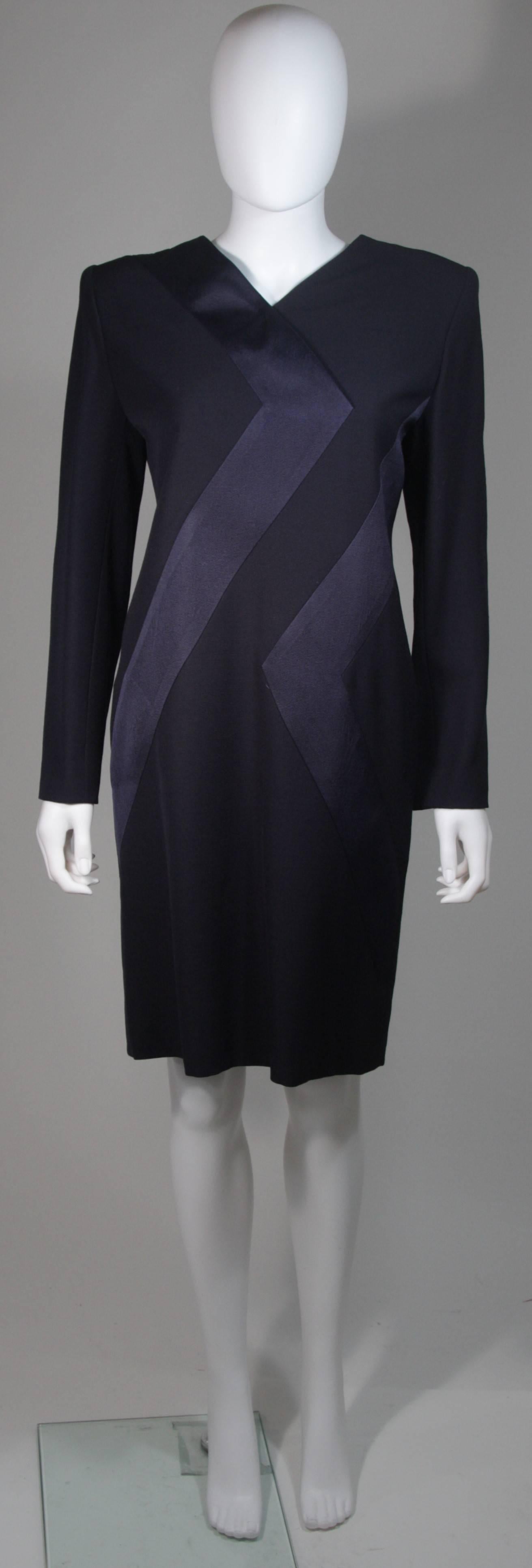 This Galanos  dress is composed of a navy silk. Features a geometric style design and a center back zipper closure. In excellent condition. Made in USA.

  **Please cross-reference measurements for personal accuracy. Size in description box is an