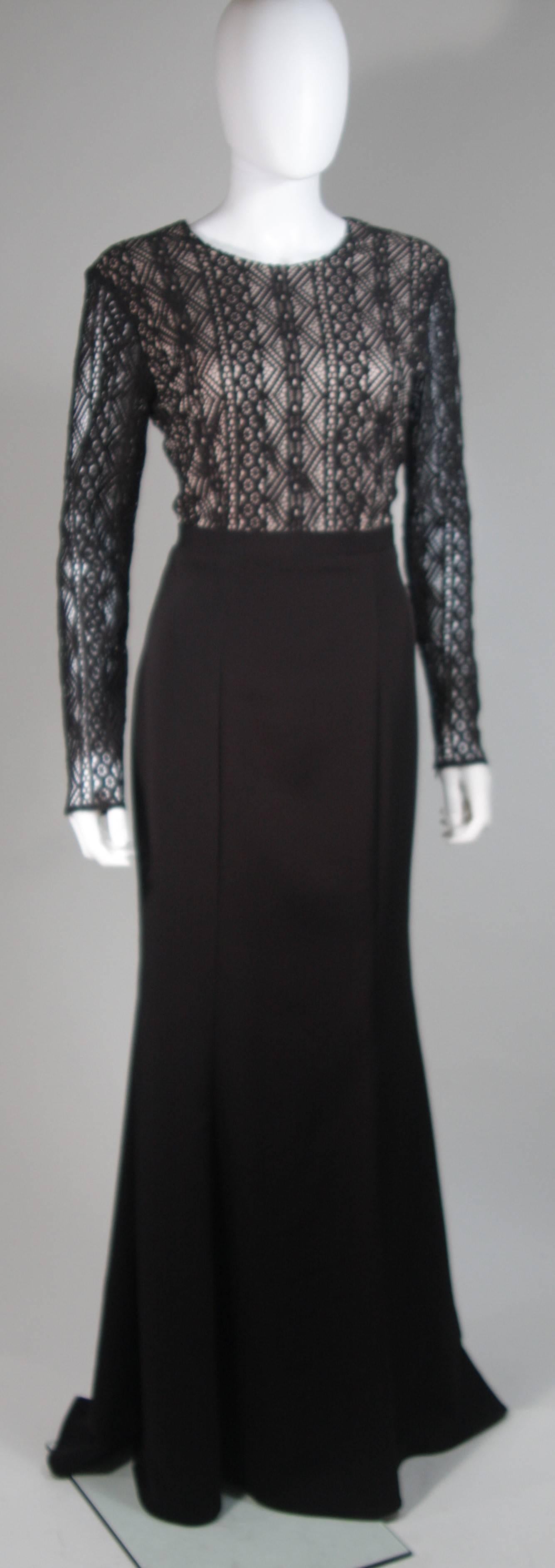 This Nah Kanh  gown is composed of a black jersey and features a lace bodice with nude tone base. There is a center back gold hue zipper. In excellent condition, with original tags. Made in USA.

  **Please cross-reference measurements for