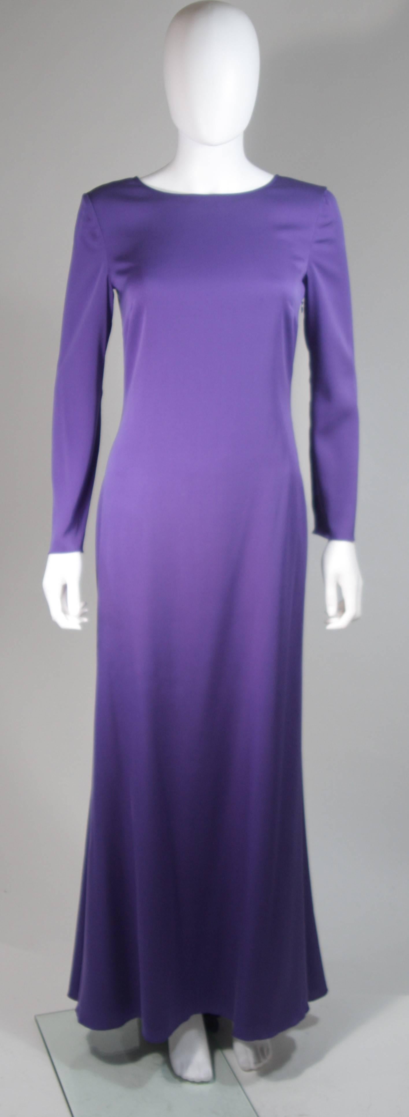 This Emilio Pucci gown is composed of a radiant soft purple silk. The classic long sleeve style is modernized with an exquisite open back. There is a side zipper closure and center back top button. In excellent condition. 

  **Please